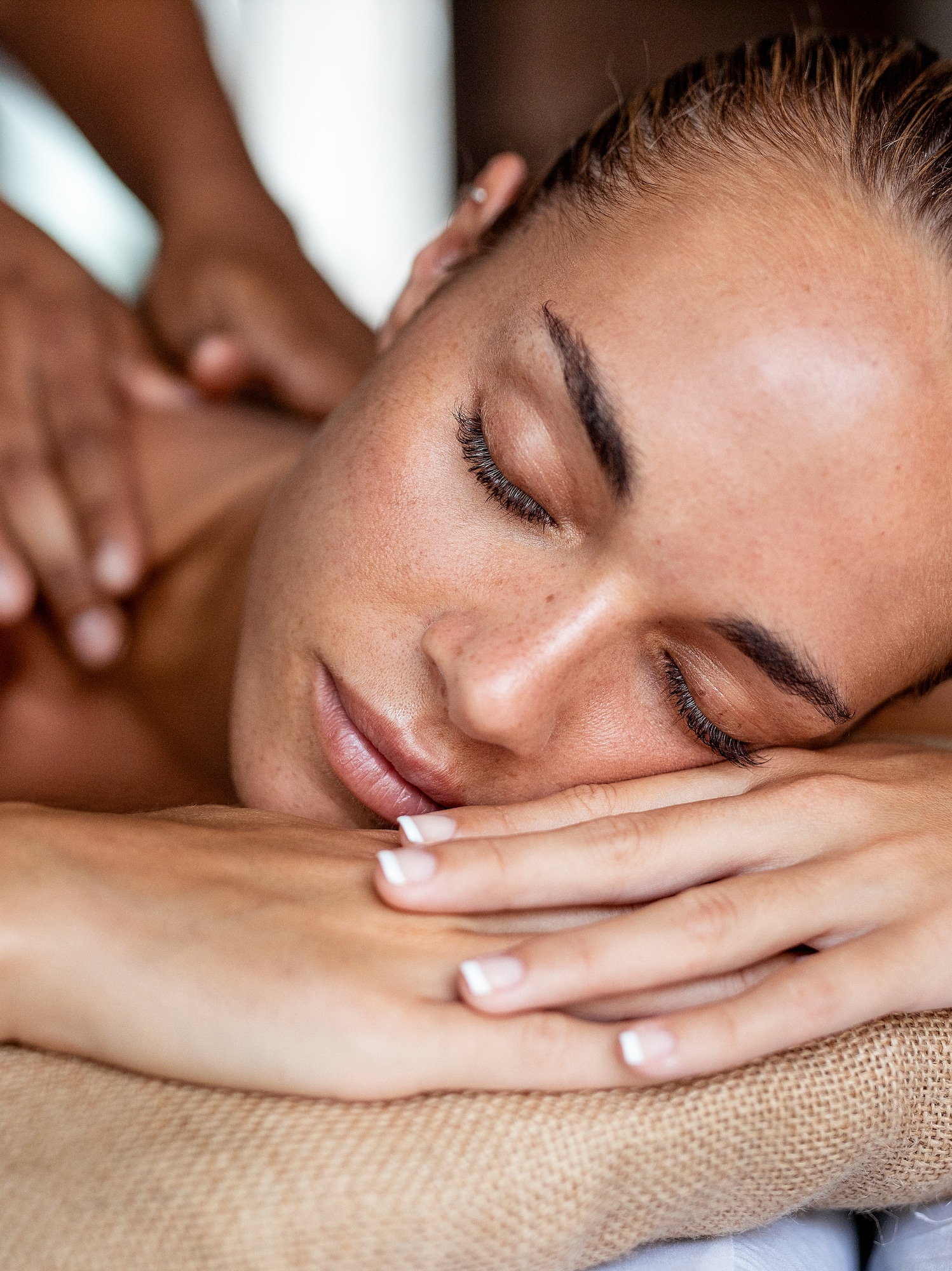 a woman lying down on a massage table