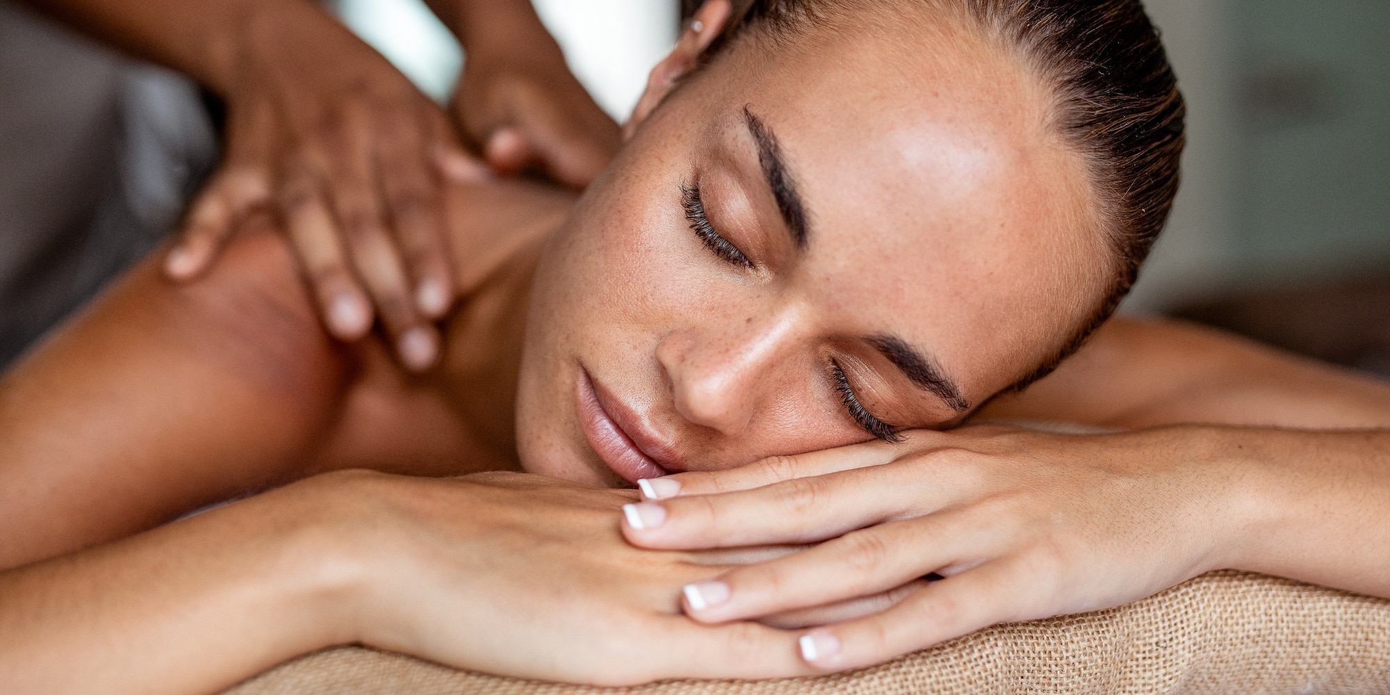 a woman lying down on a massage table