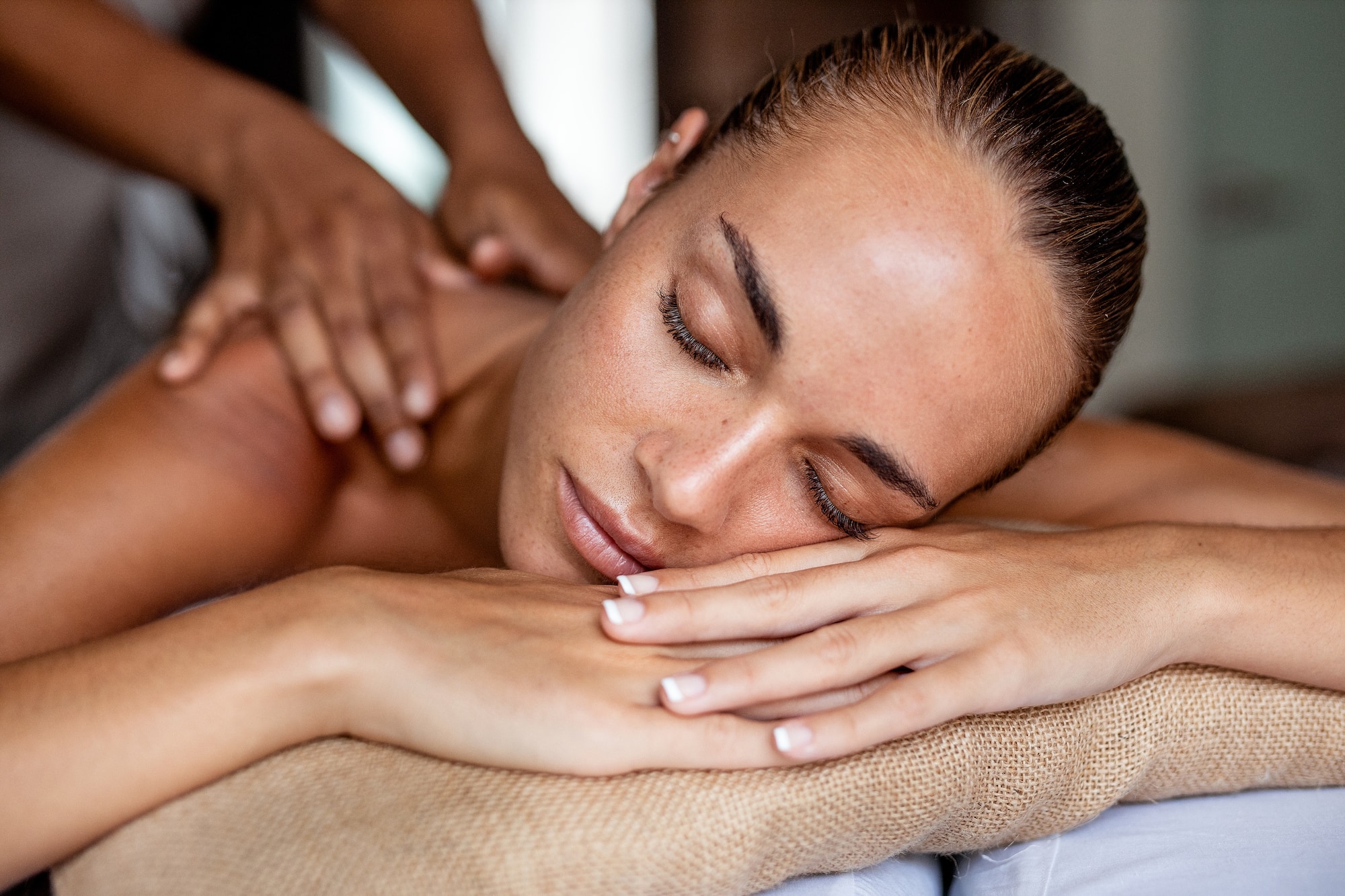 a woman lying down on a massage table