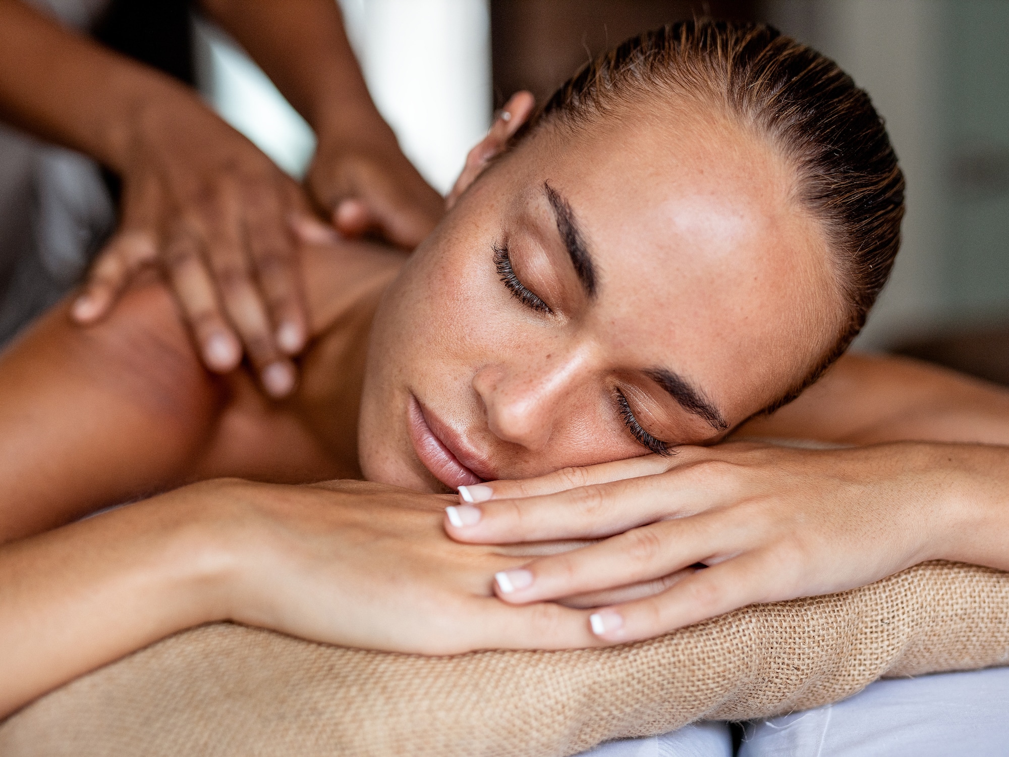 a woman lying down on a massage table