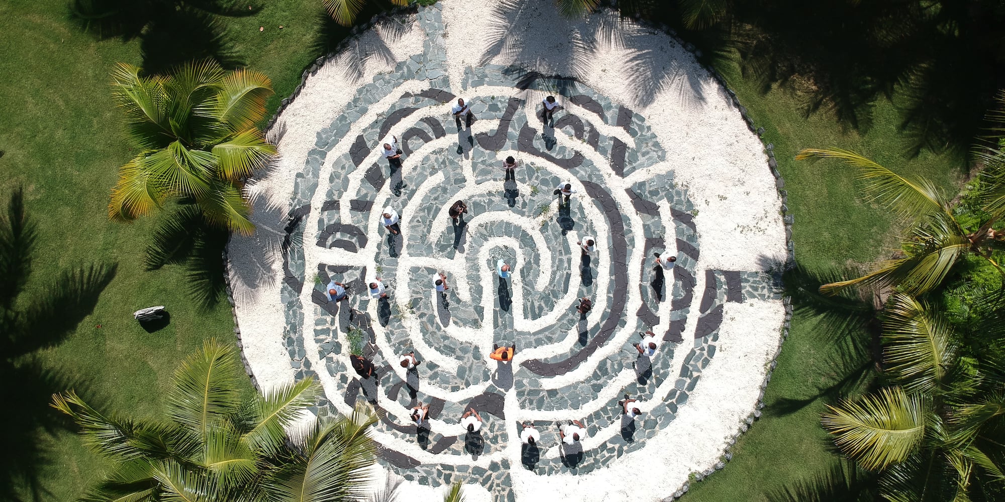 a circular maze with people walking around