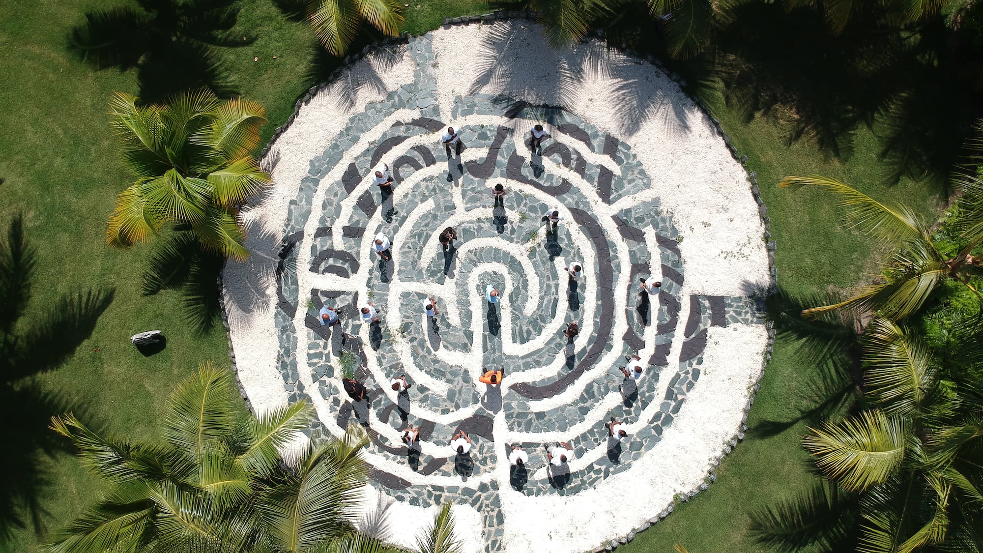 a circular maze with people walking around