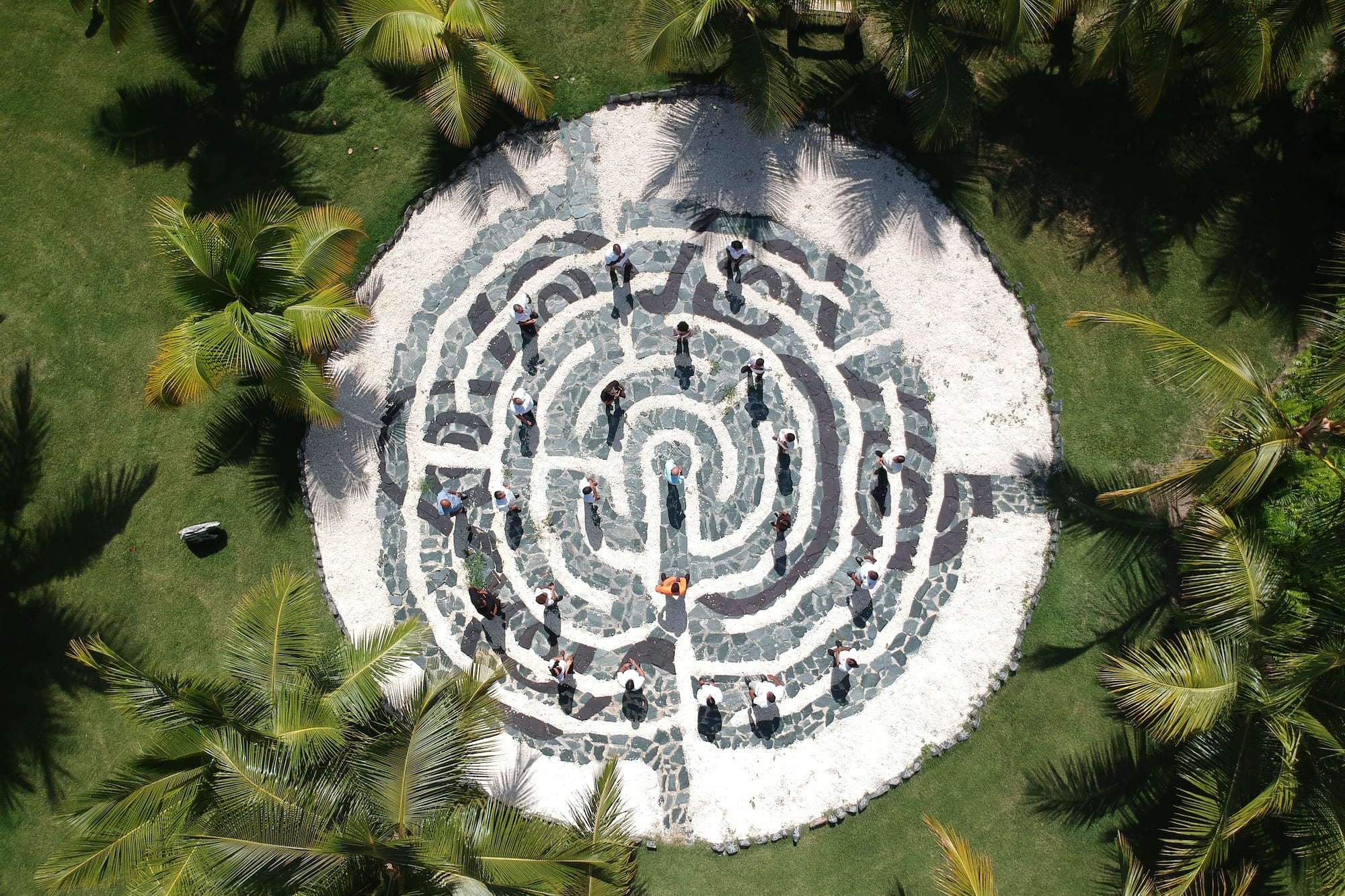a circular maze with people walking around