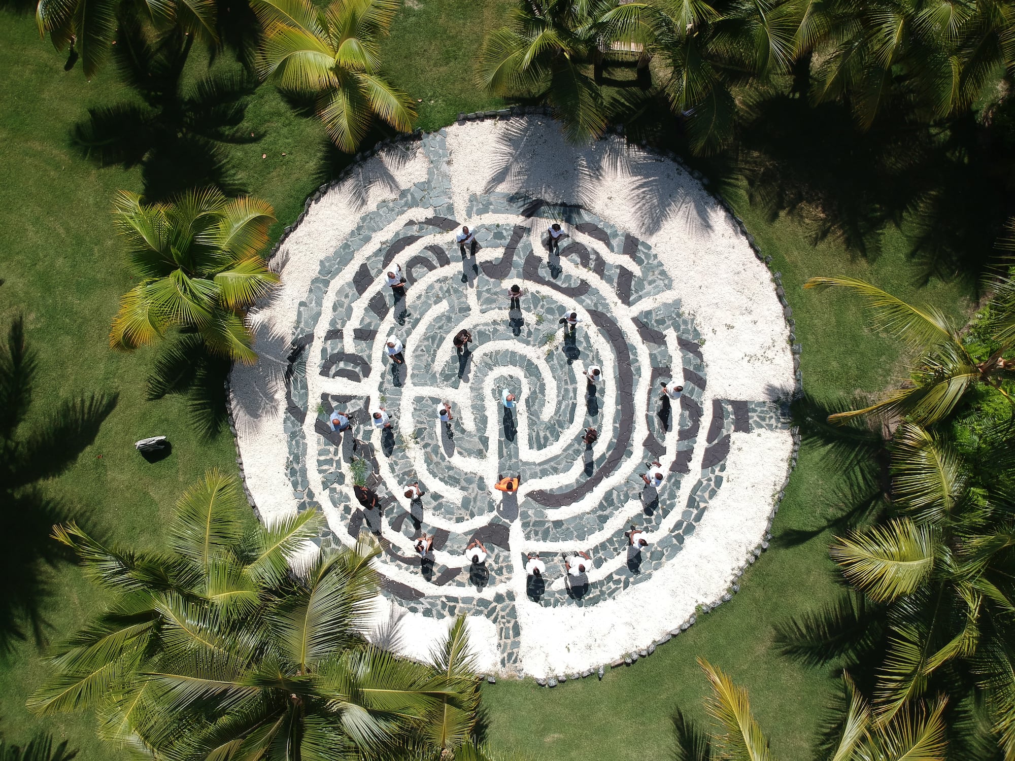 a circular maze with people walking around