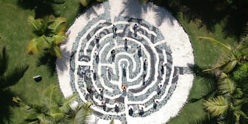 a circular maze with people walking around