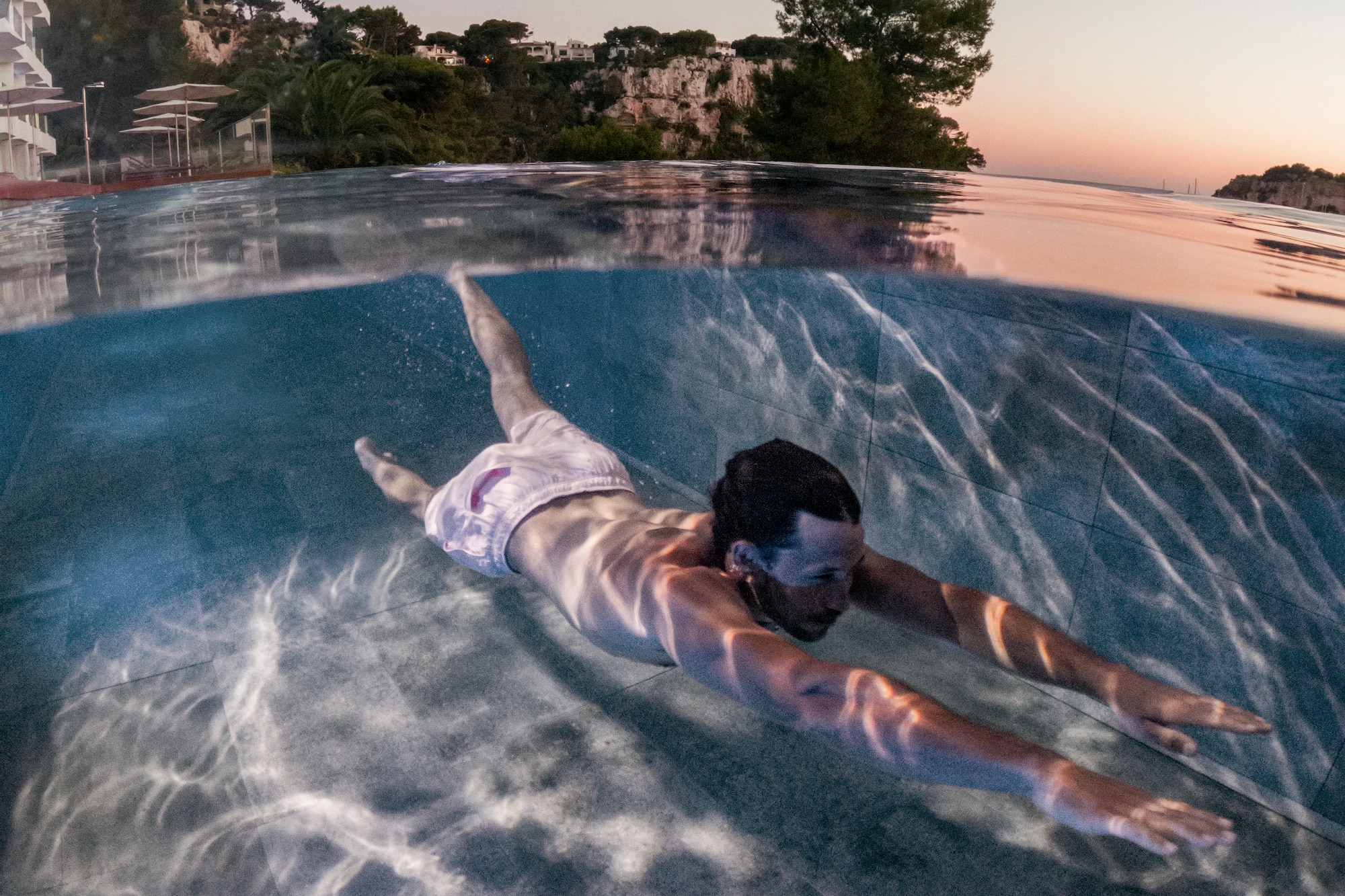 a man swimming in a pool