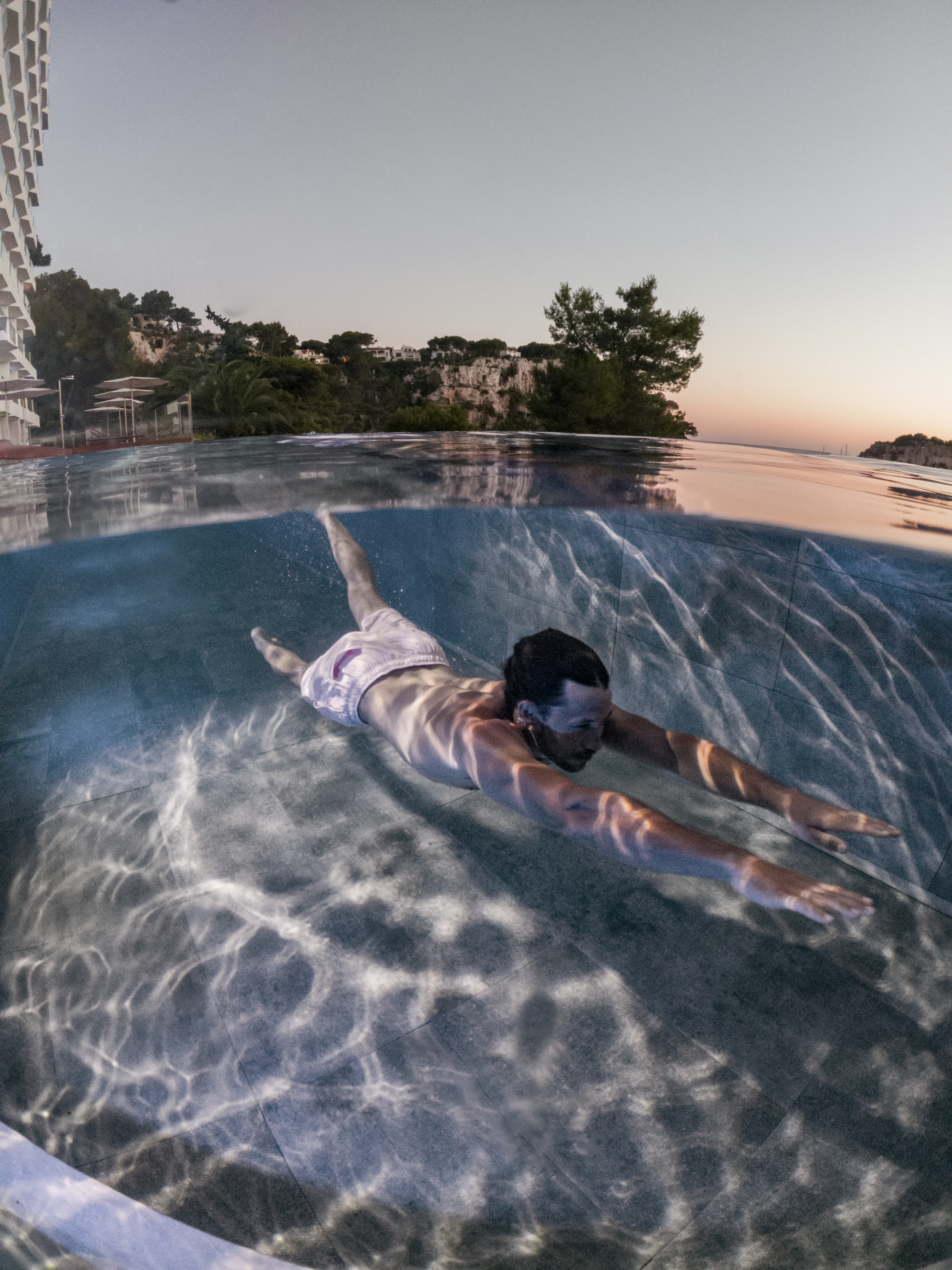 a man swimming in a pool
