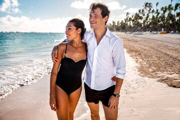a man and woman on a beach