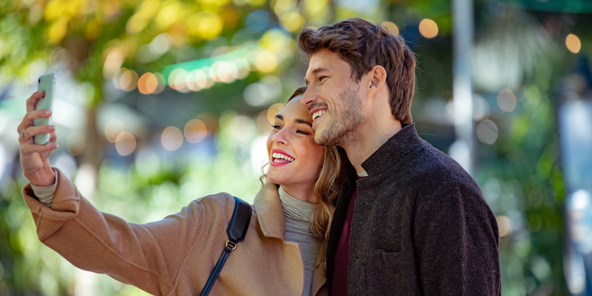 a man and woman taking a selfie