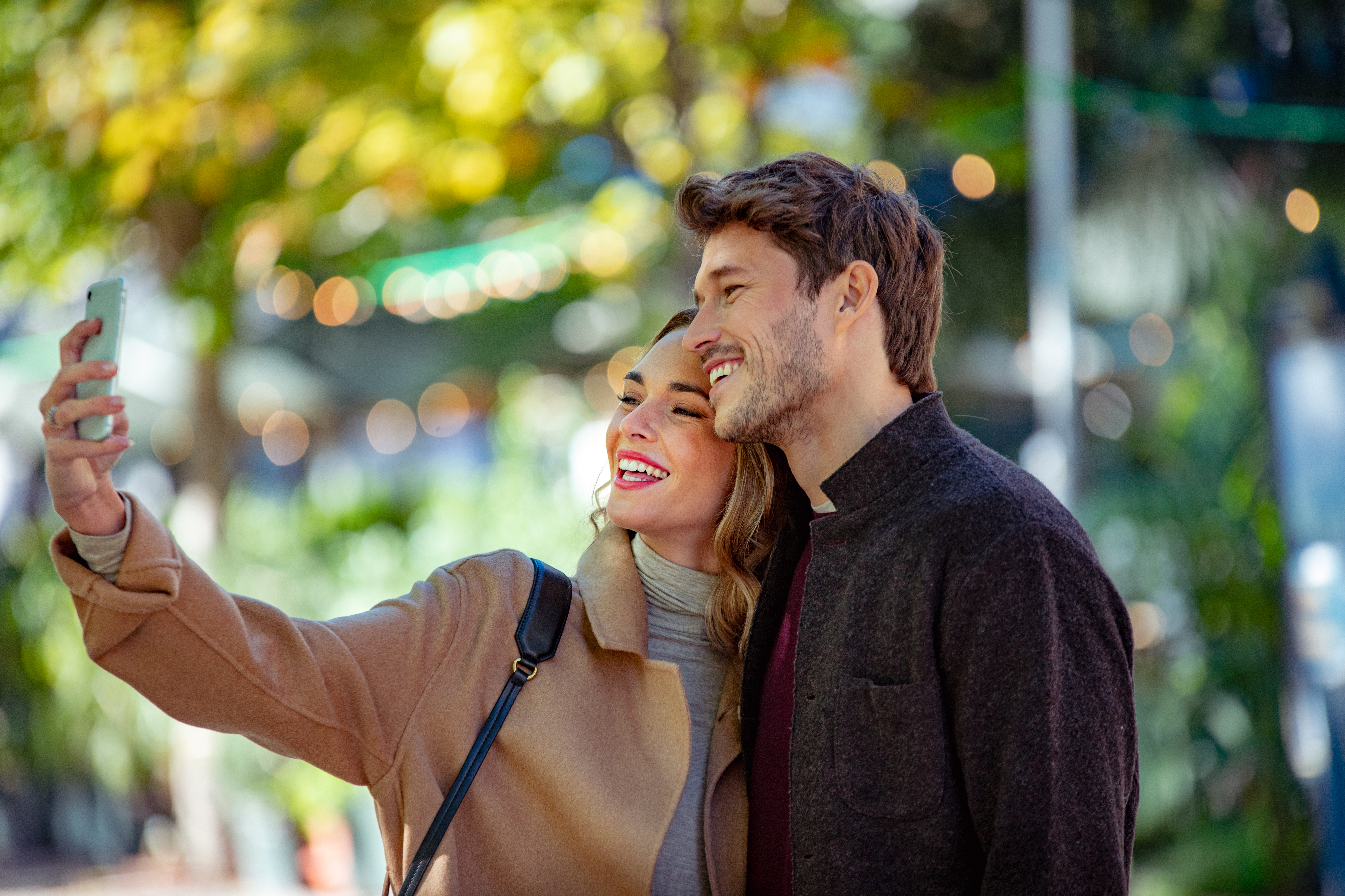 a man and woman taking a selfie