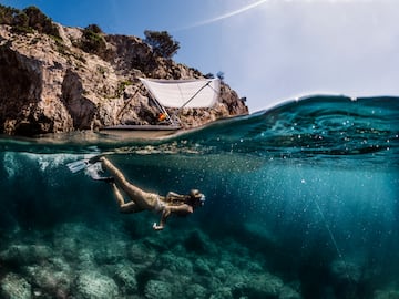 a woman swimming under water
