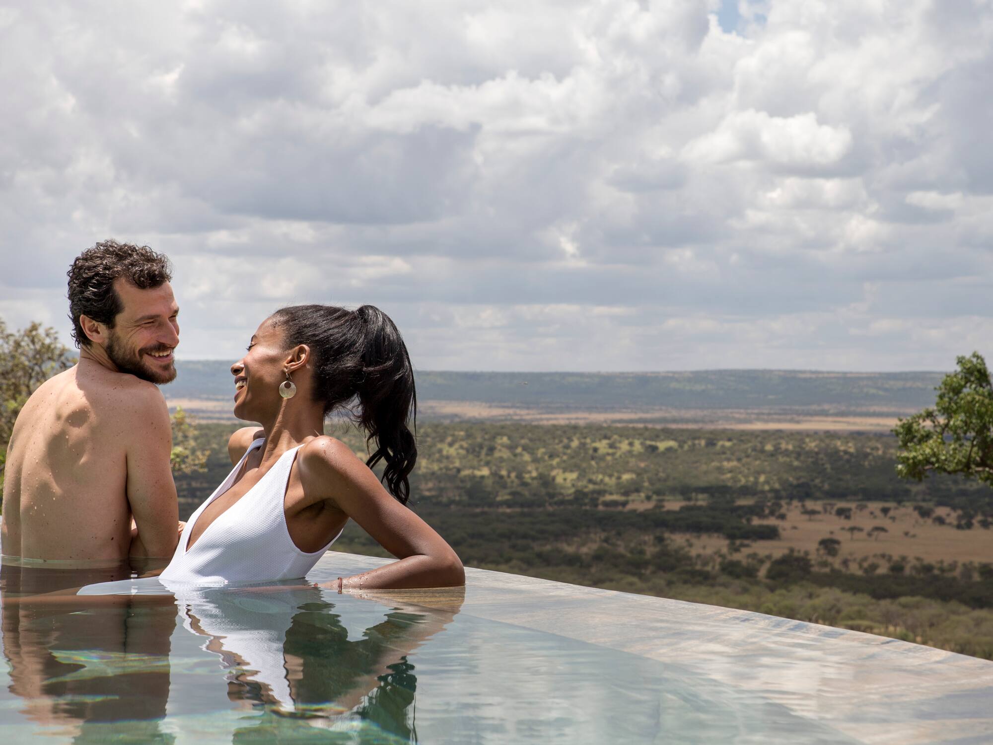a man and woman in a pool
