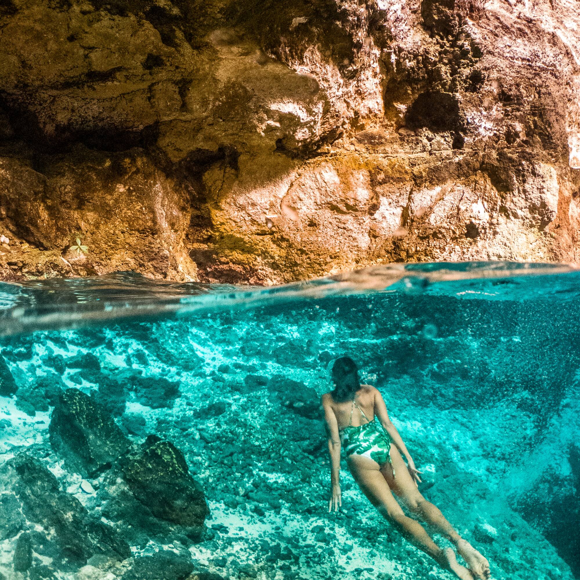 a woman in a swimsuit underwater