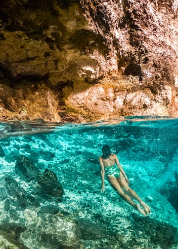 a woman in a swimsuit underwater