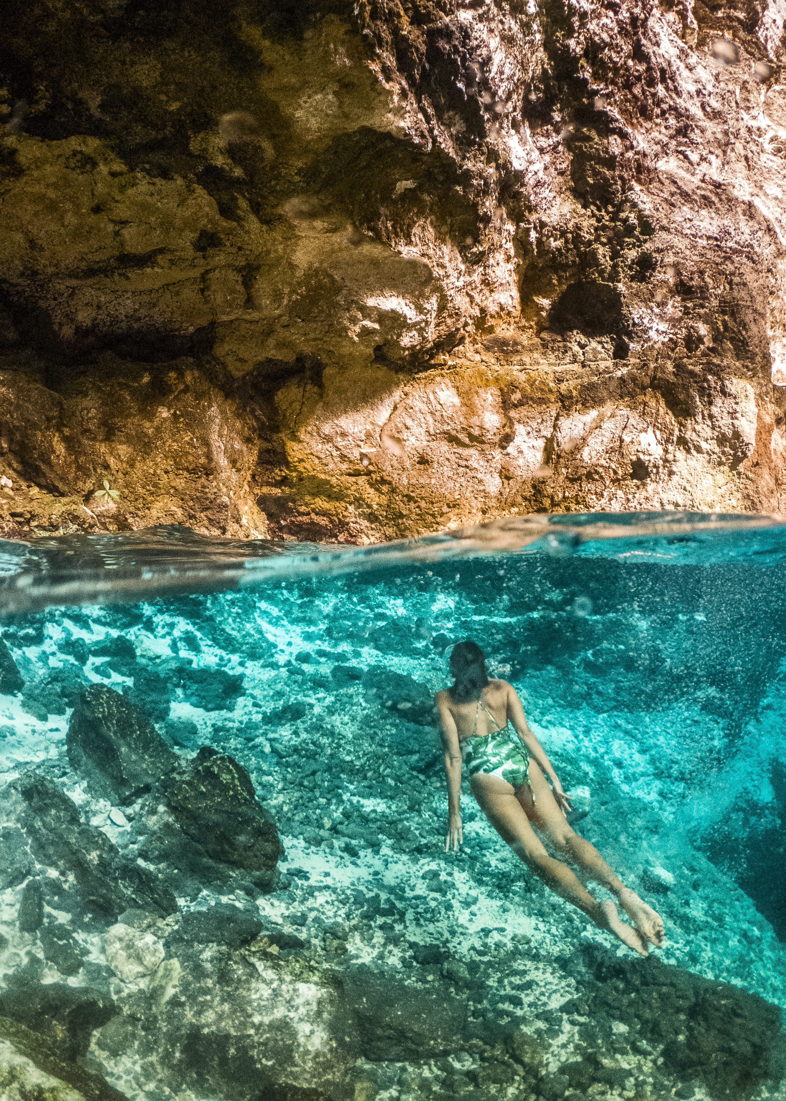 a woman in a swimsuit underwater
