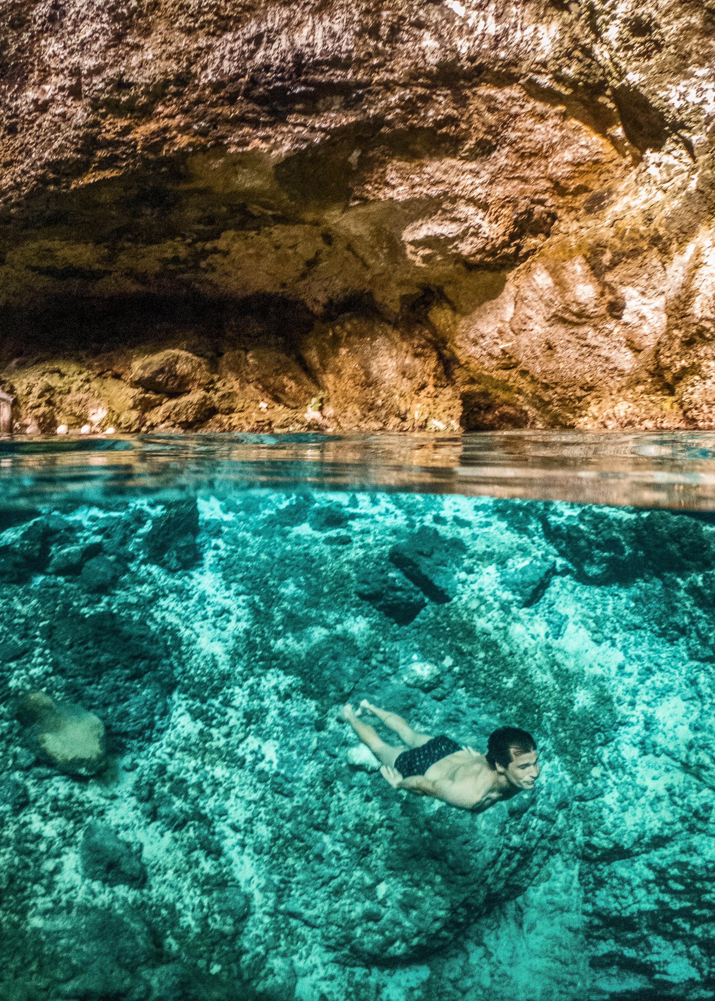 a man swimming under water