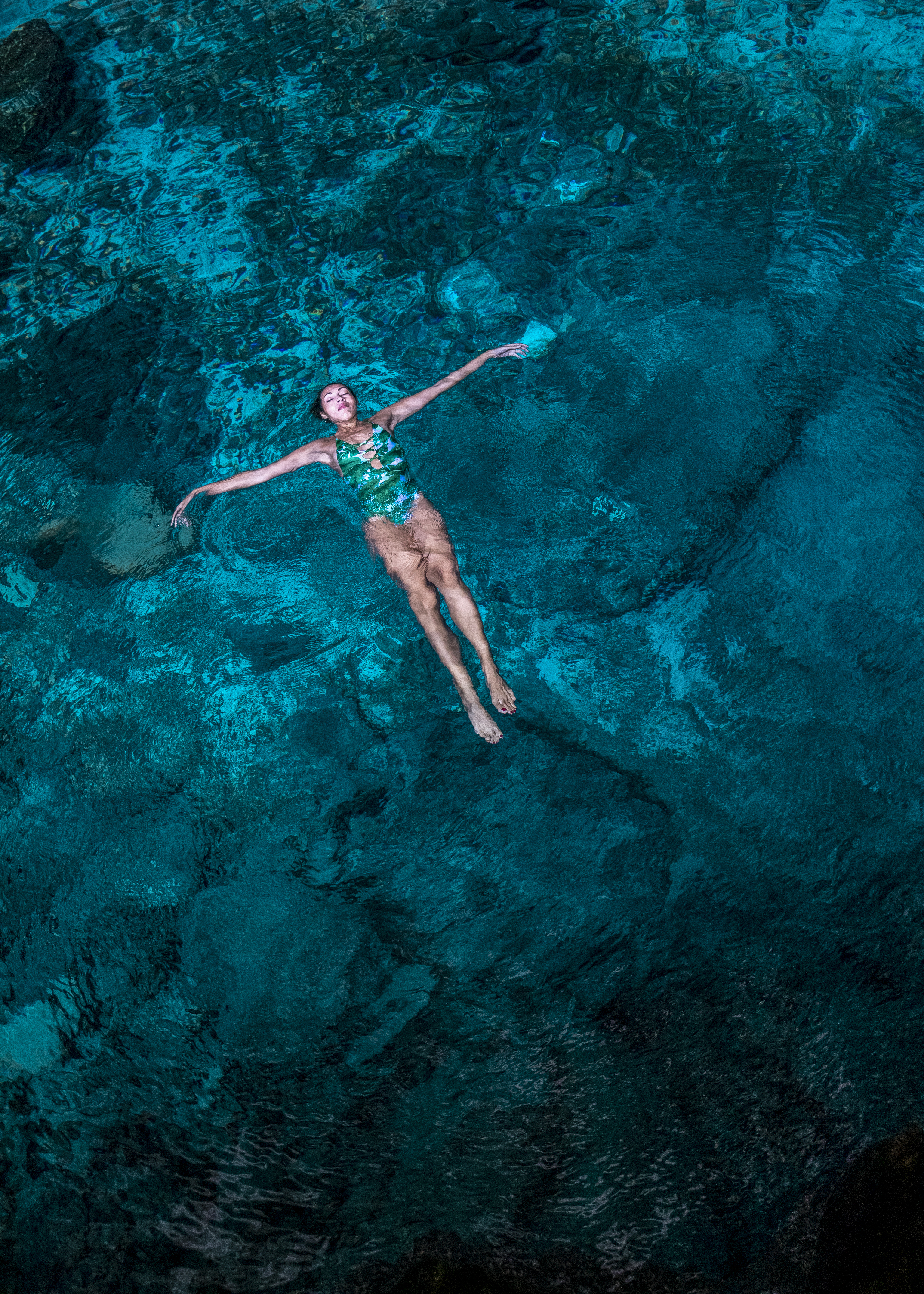 a woman floating in a body of water