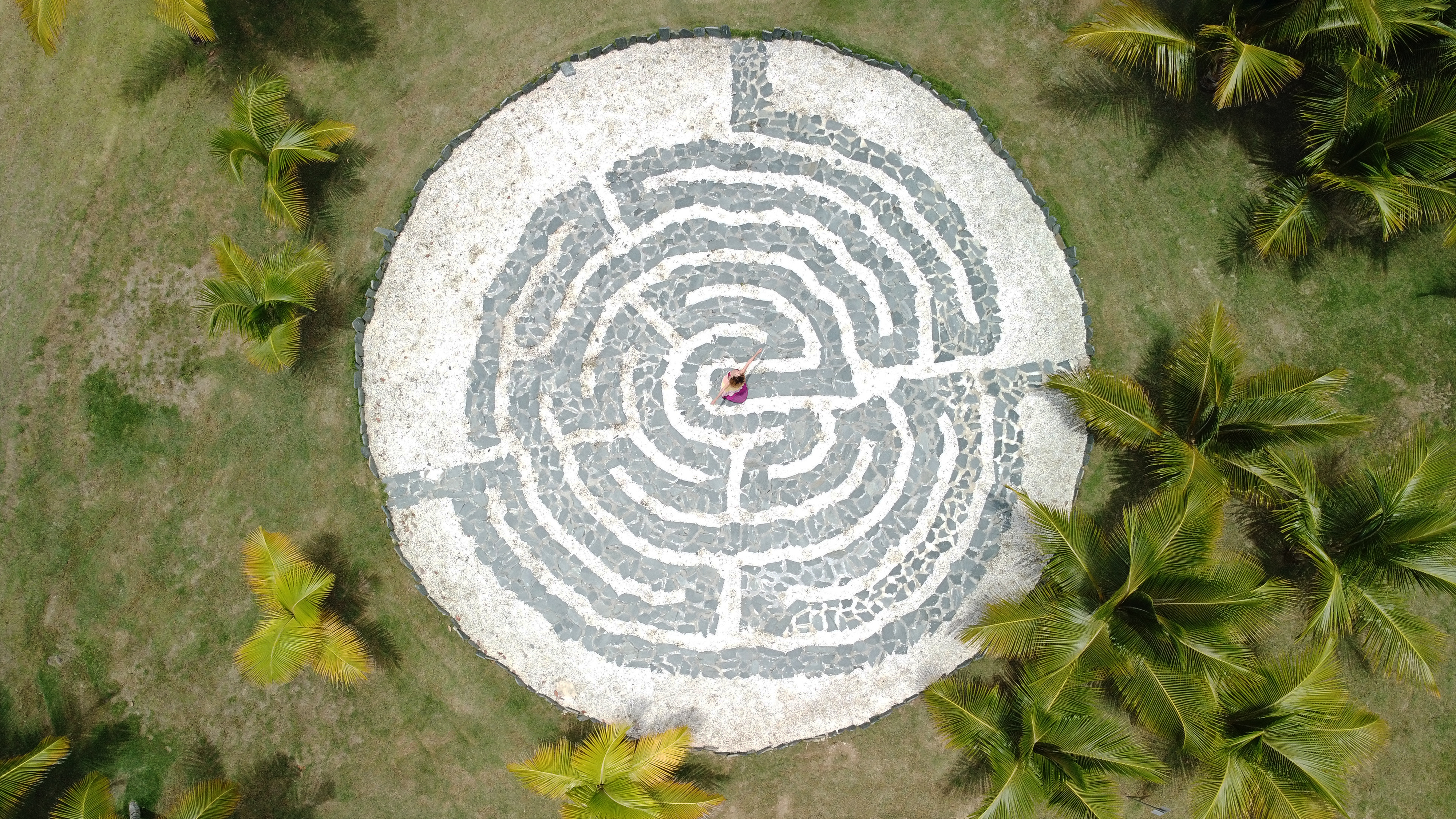a woman in a circular maze