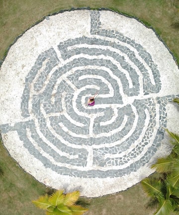 a woman in a circular maze
