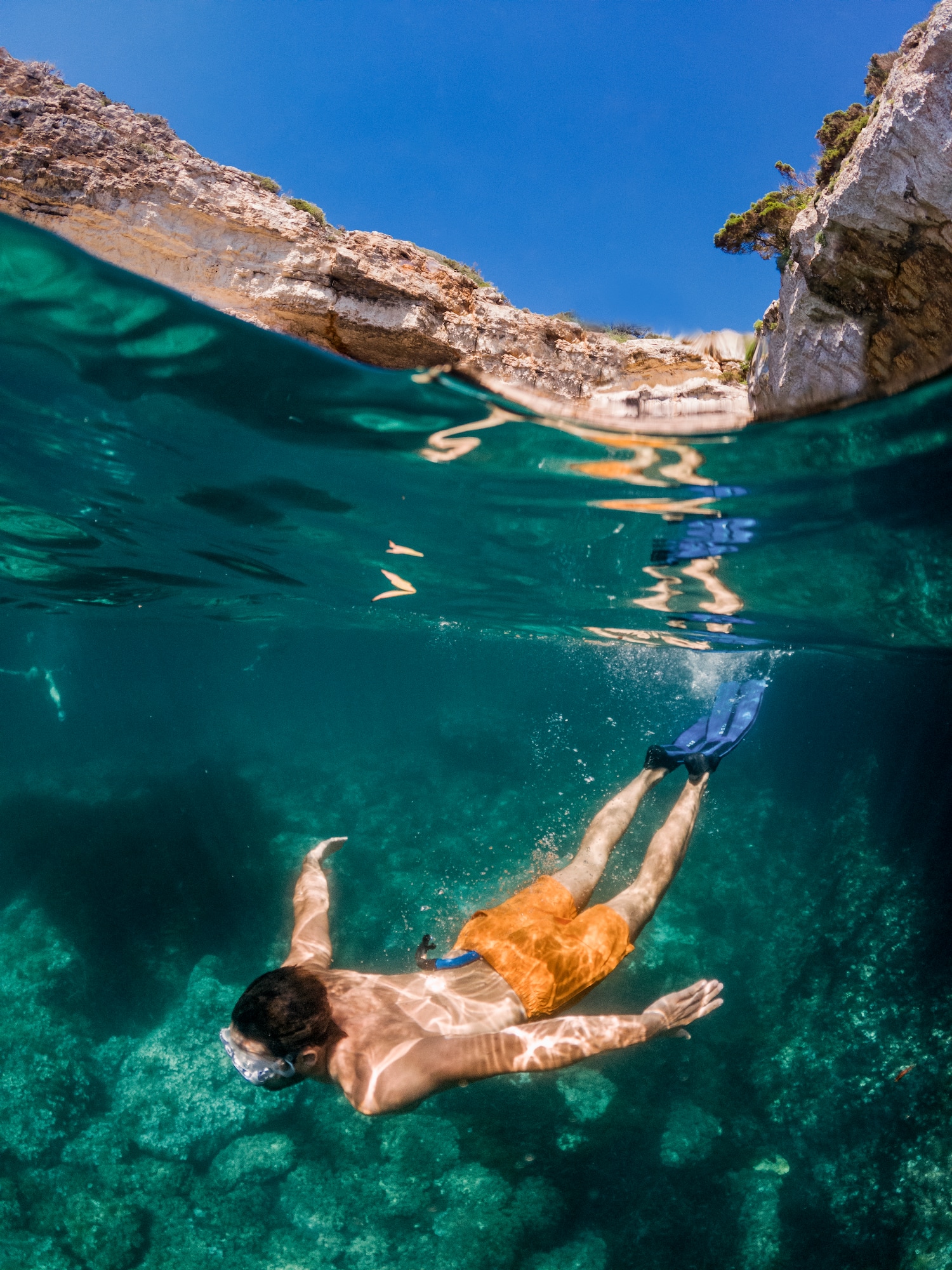 a man swimming under water