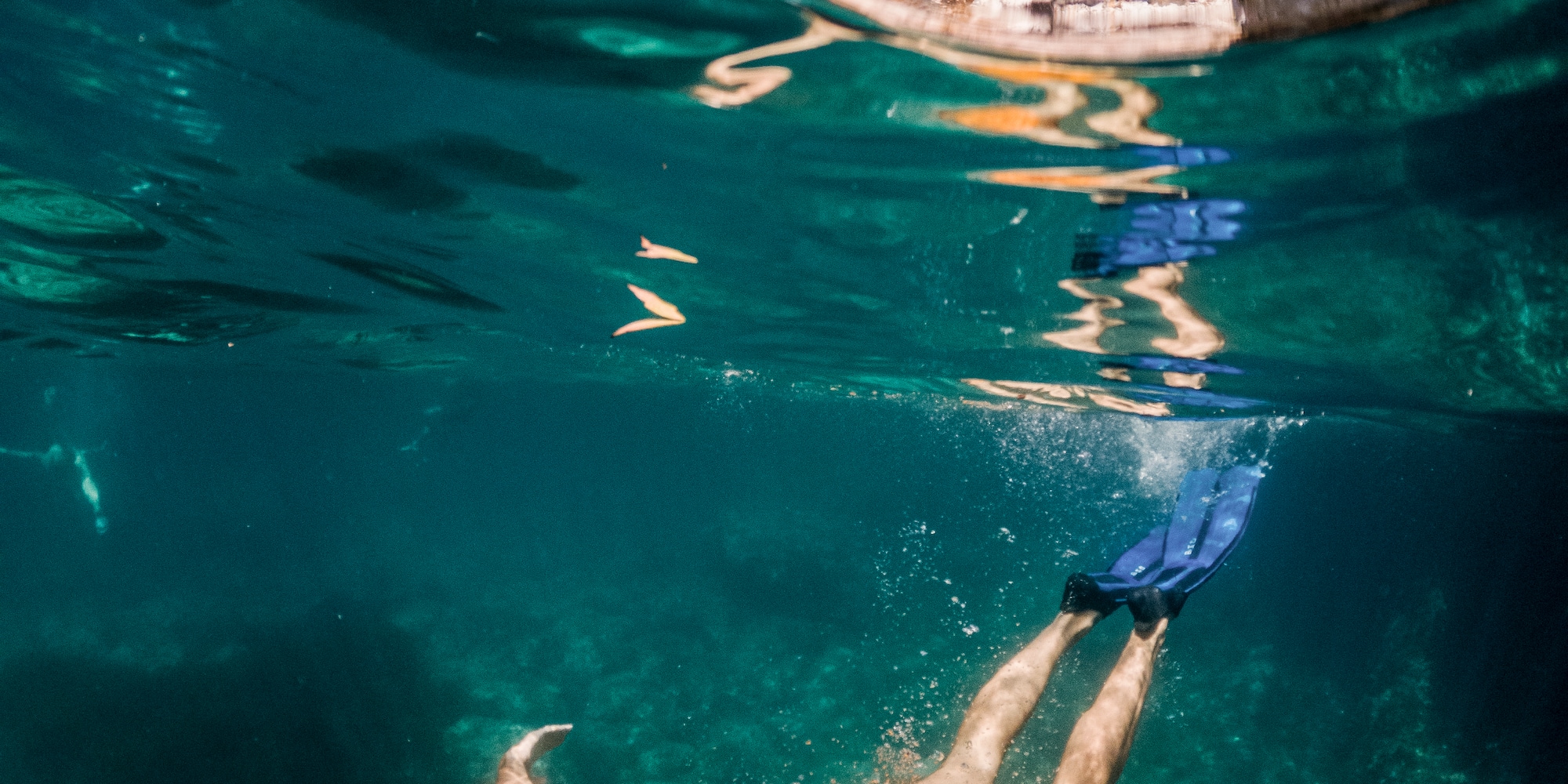 a man swimming under water