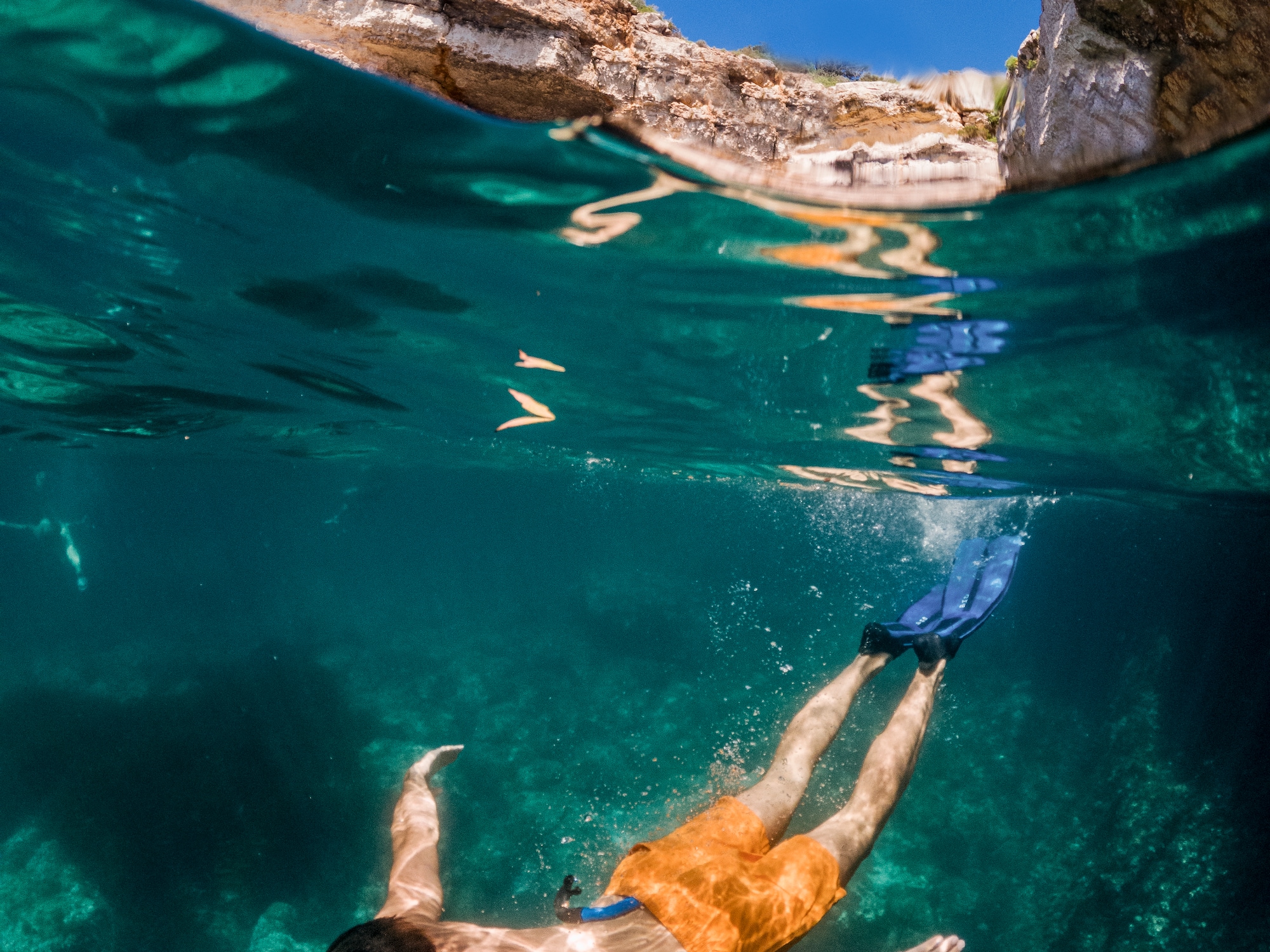 a man swimming under water
