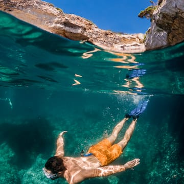 a man swimming under water