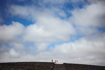 people walking up a hill