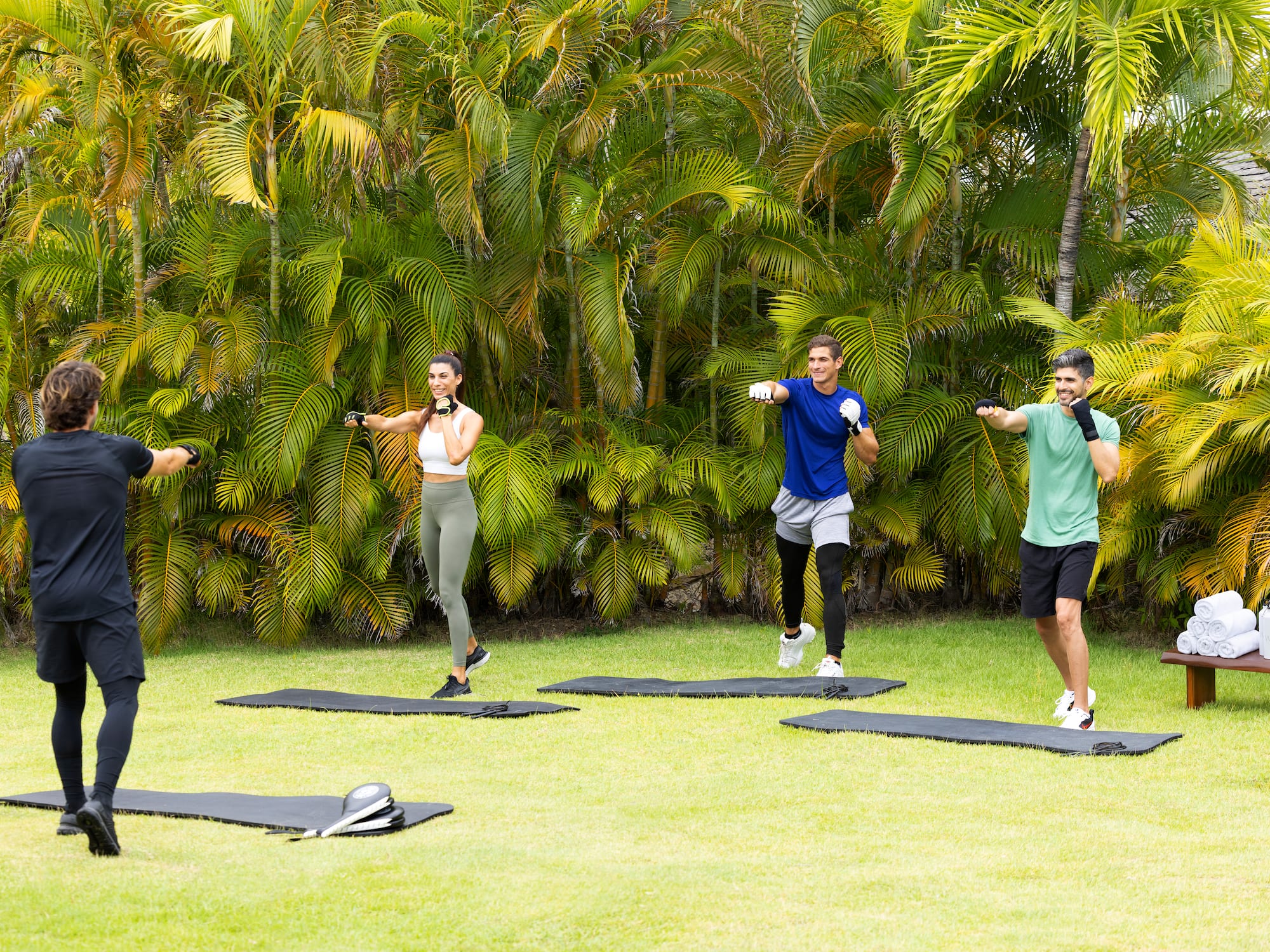 a group of people exercising on mats