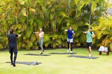 a group of people exercising on mats