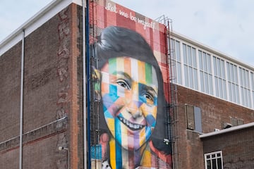 a mural of a woman on a building