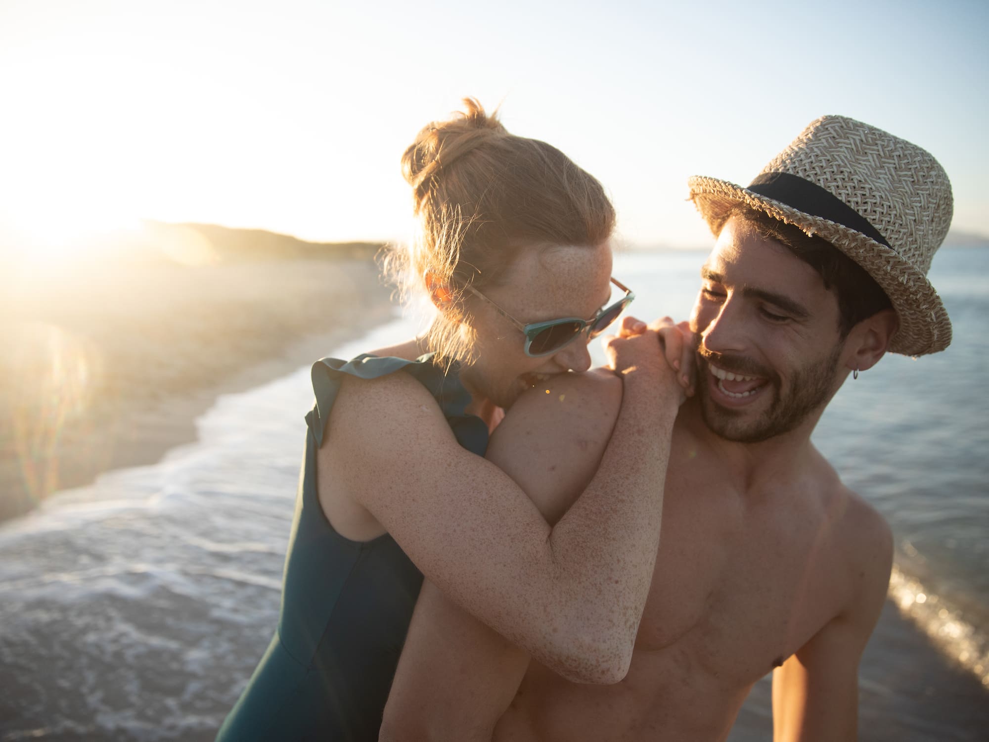 a man and woman on a beach