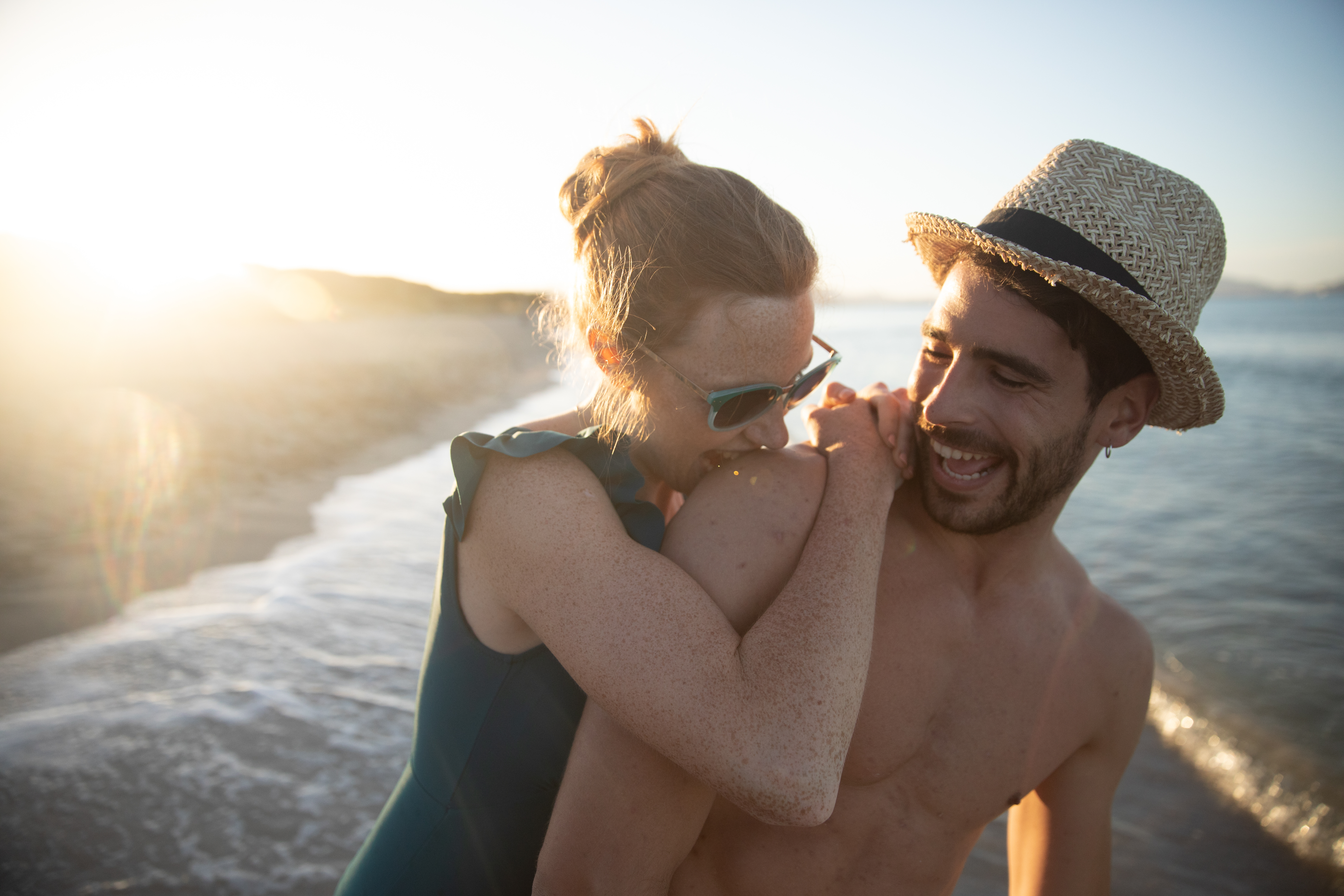 a man and woman on a beach