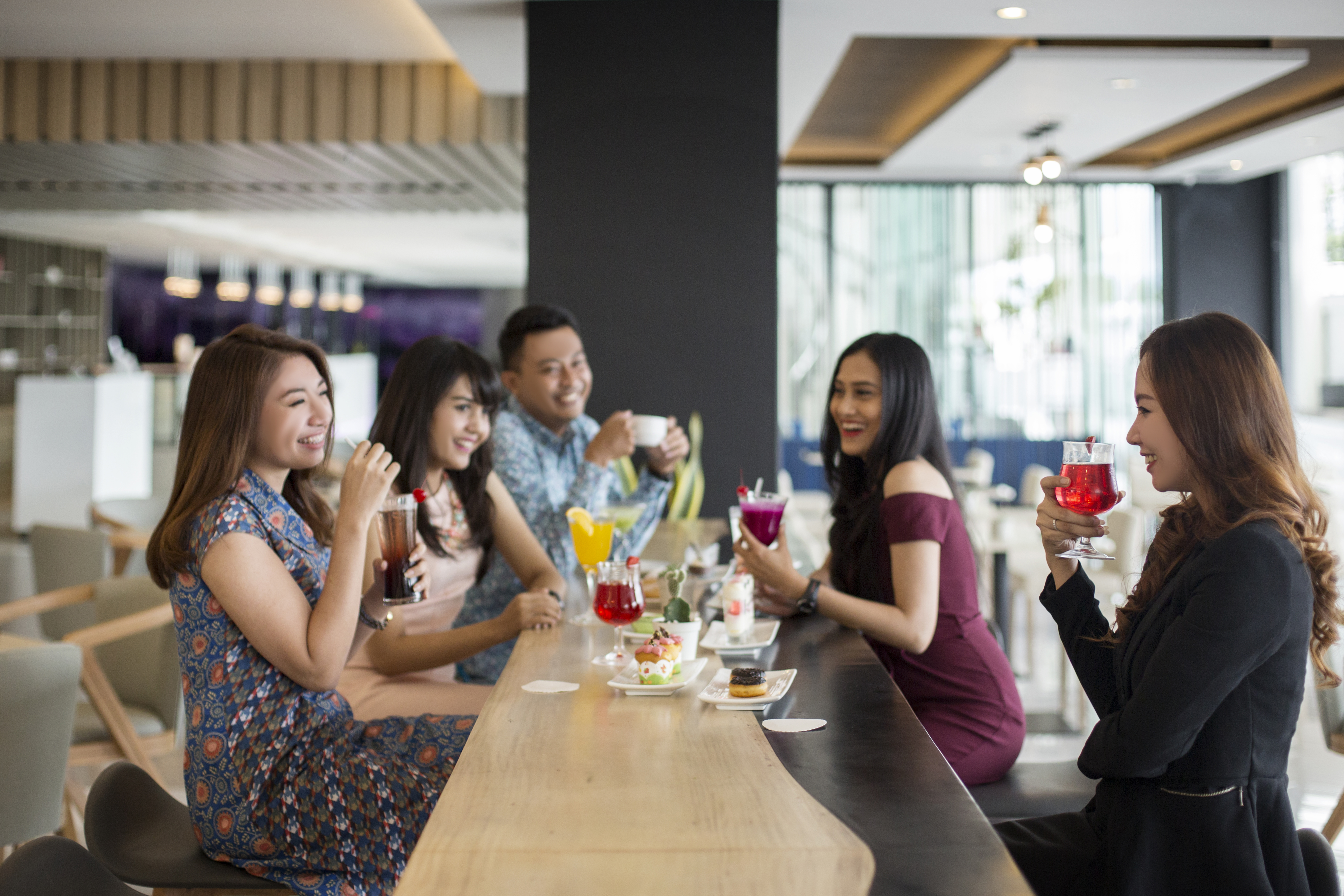 a group of people sitting at a bar