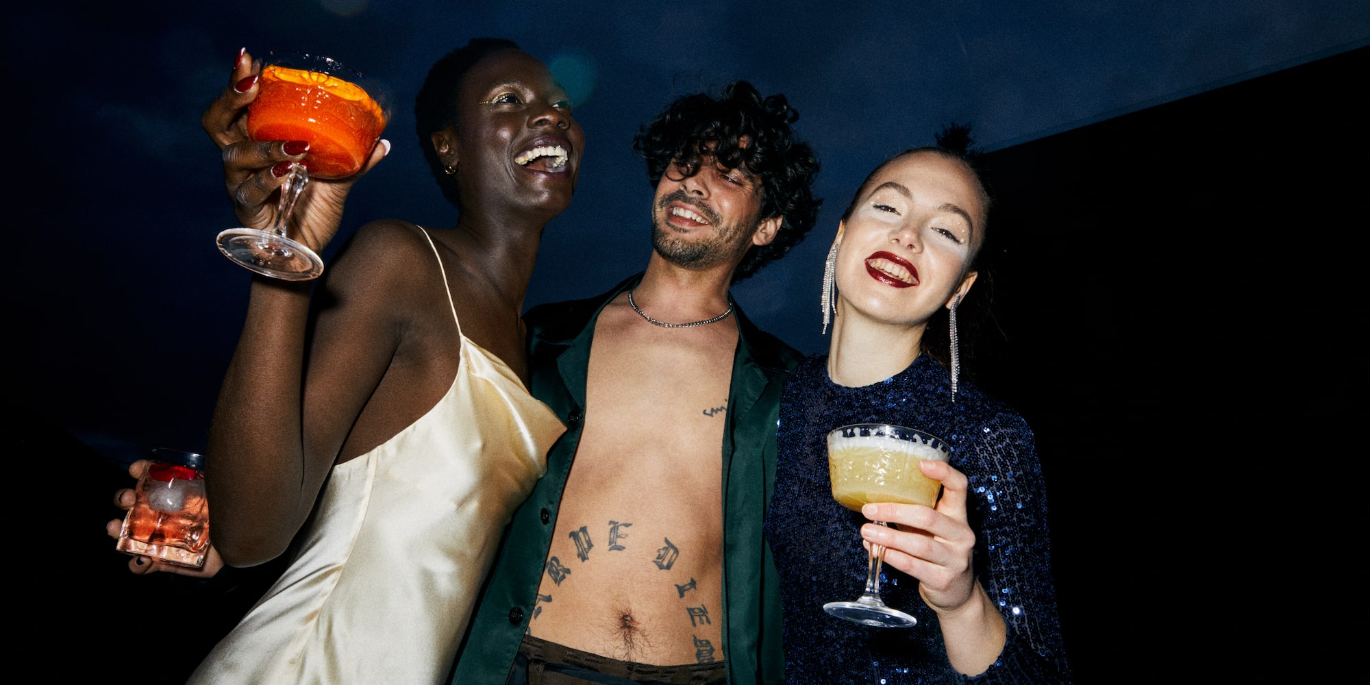 a group of people holding drinks