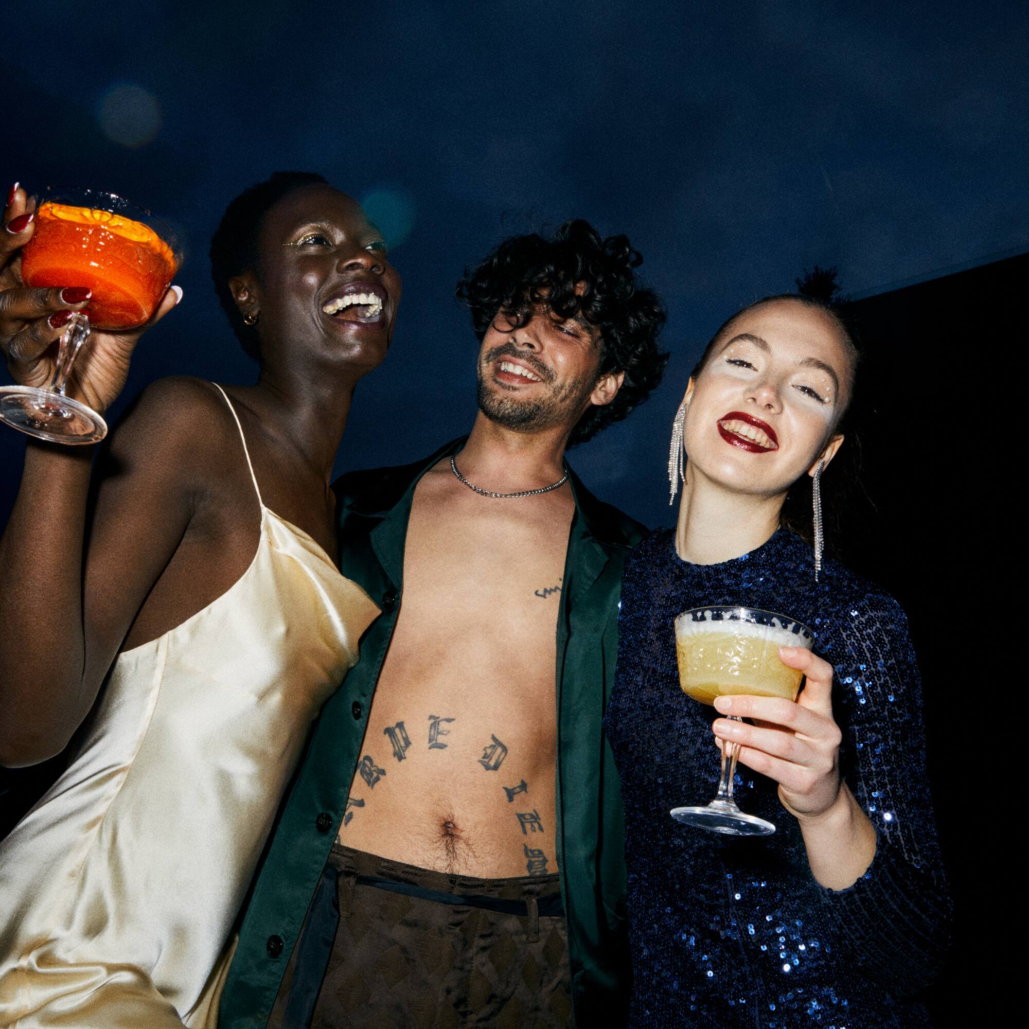 a group of people holding drinks