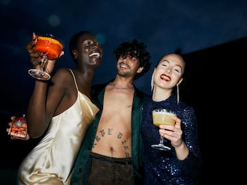 a group of people holding drinks