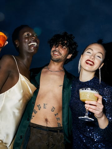 a group of people holding drinks
