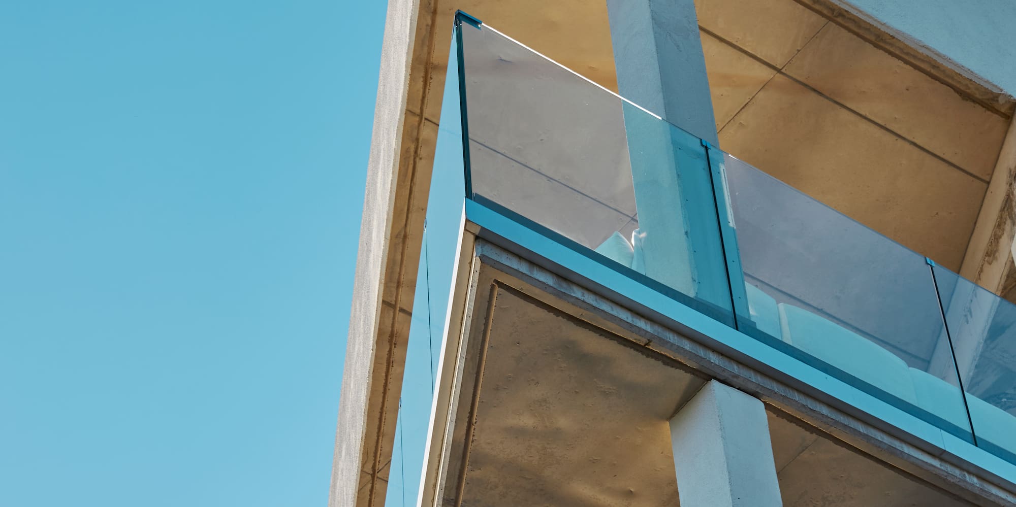 a building with glass balconies