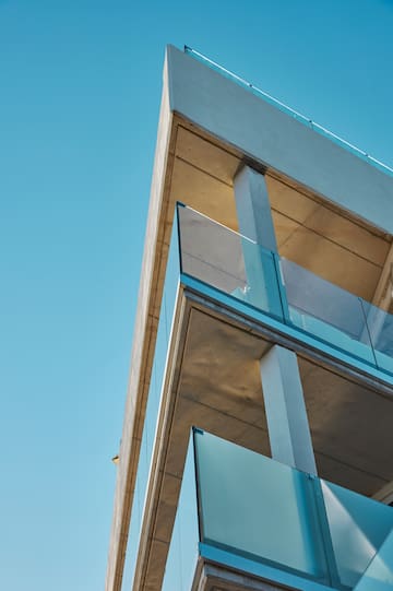 a building with glass balconies