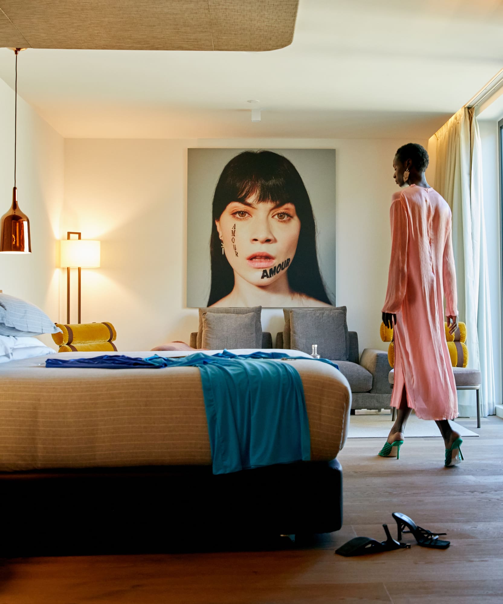 a woman walking in a hotel room