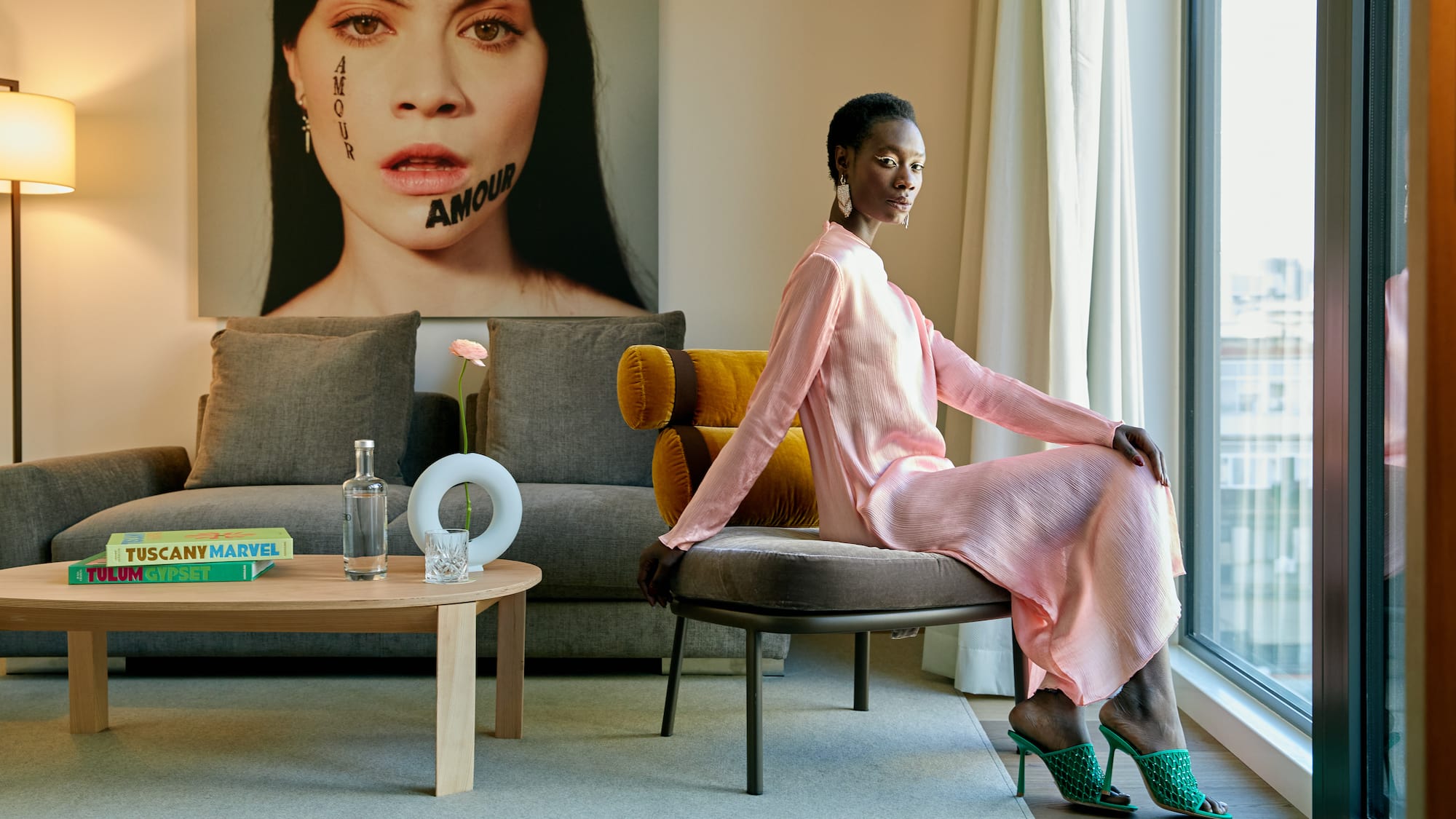 a woman sitting on a chair in a room