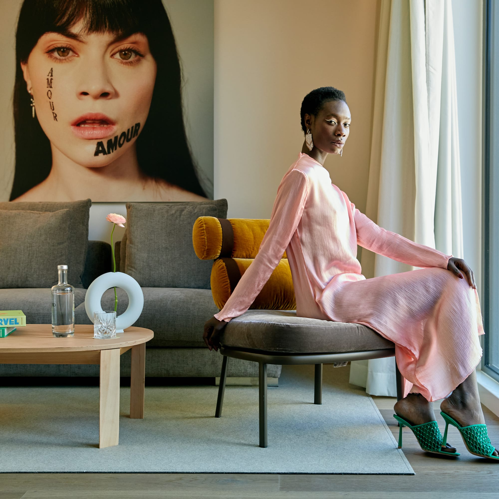 a woman sitting on a chair in a room