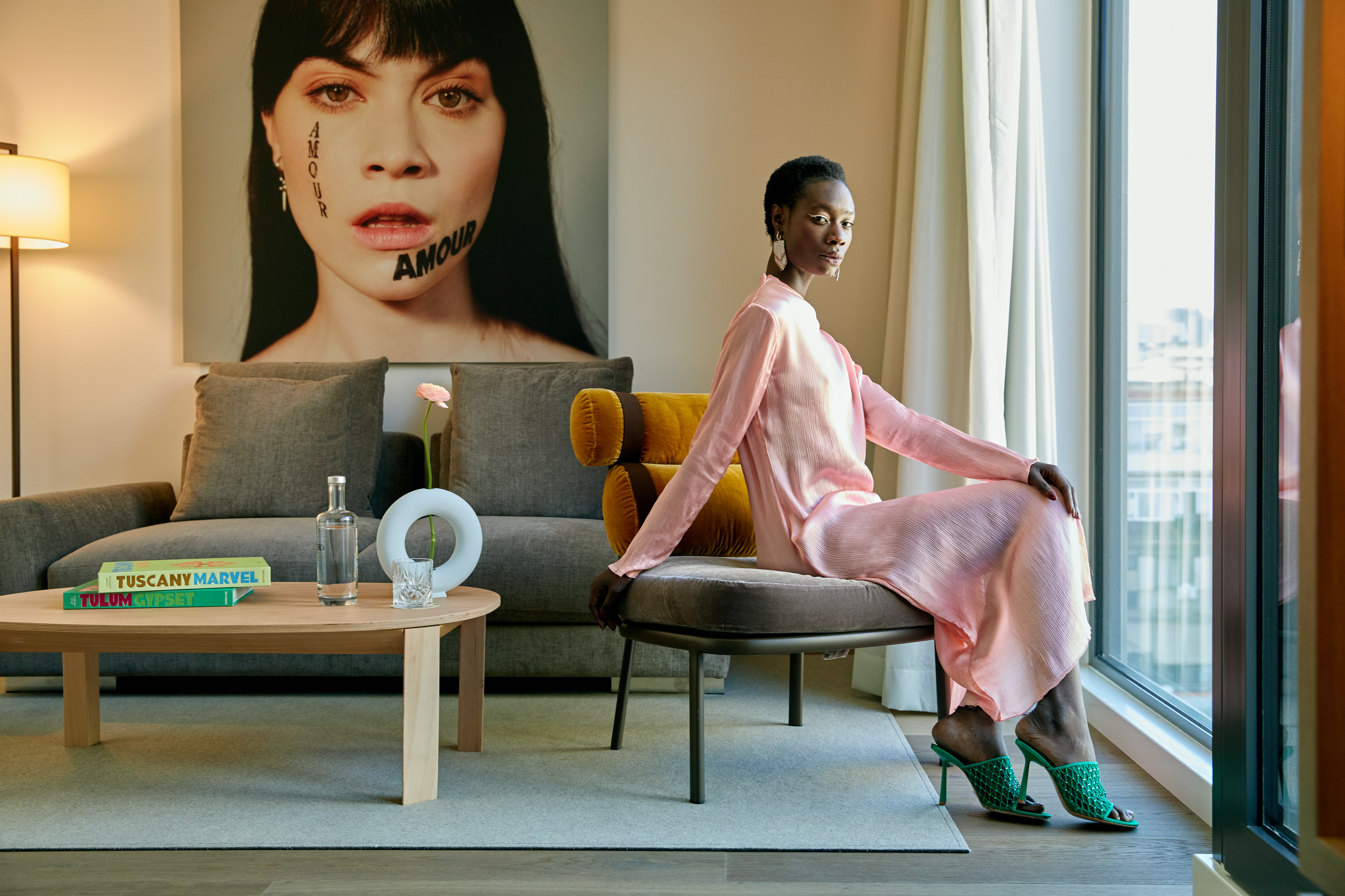 a woman sitting on a chair in a room
