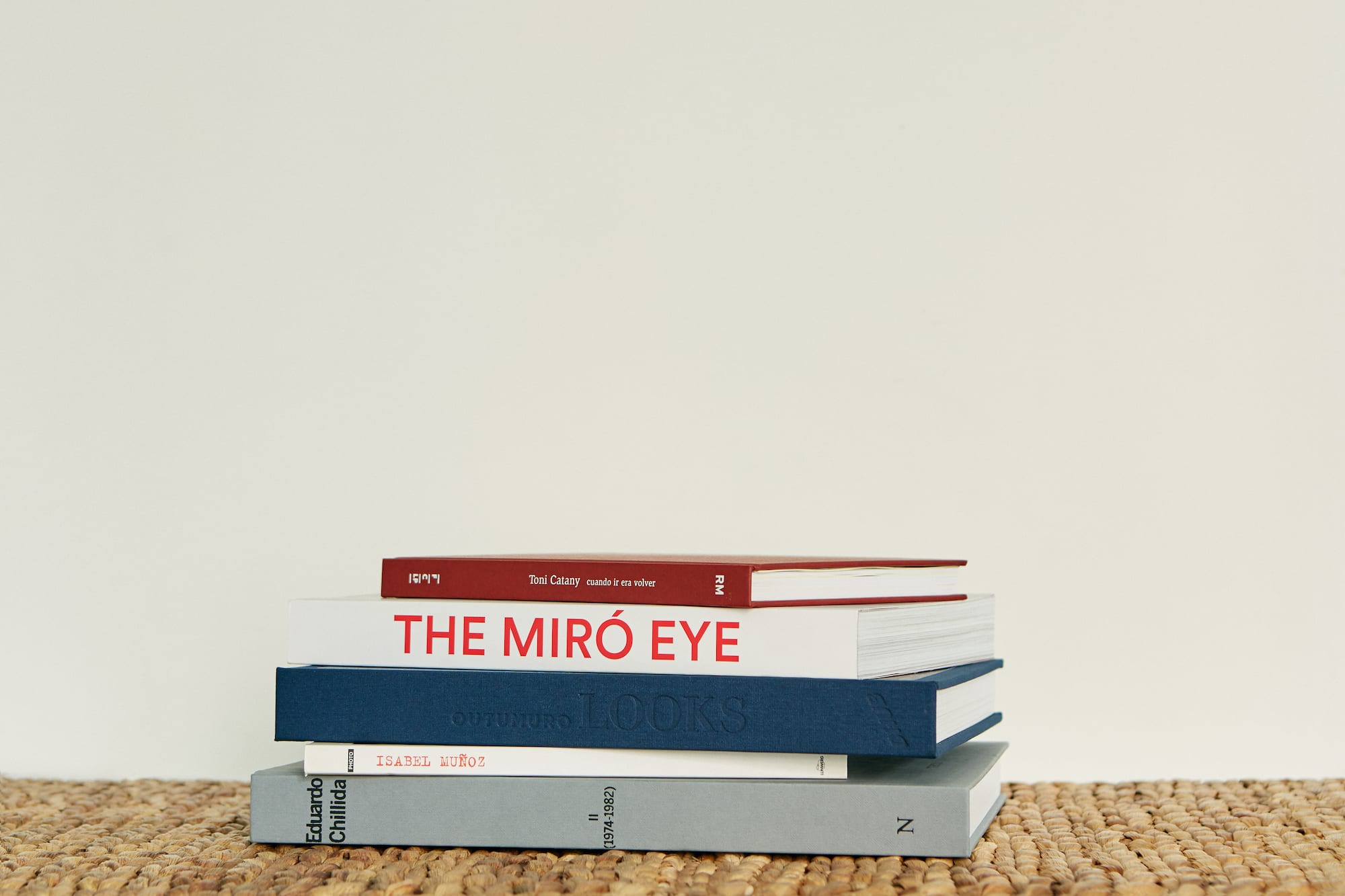a stack of books on a mat