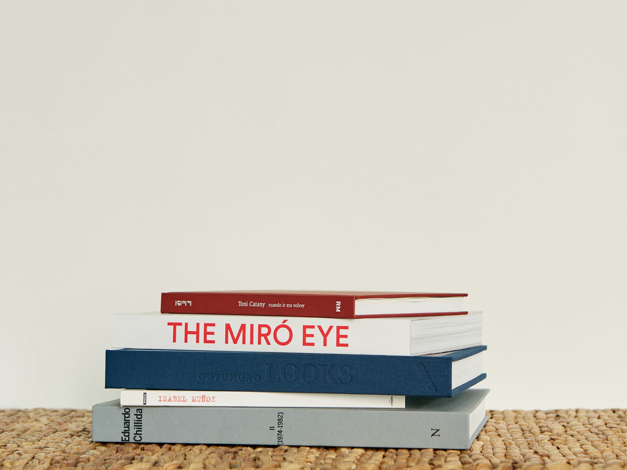 a stack of books on a mat