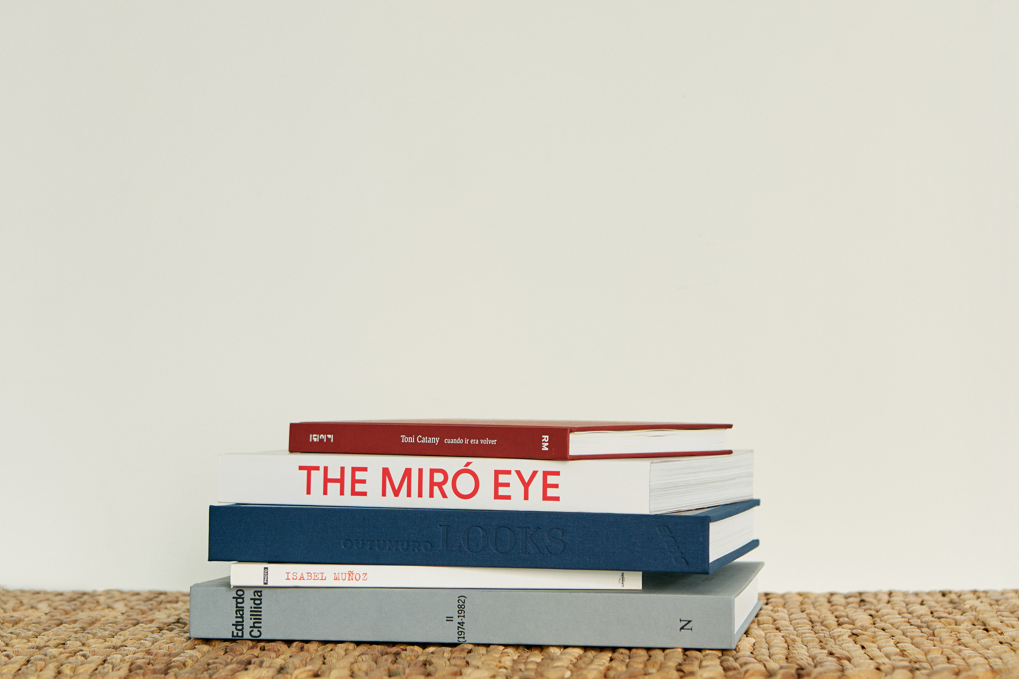 a stack of books on a mat