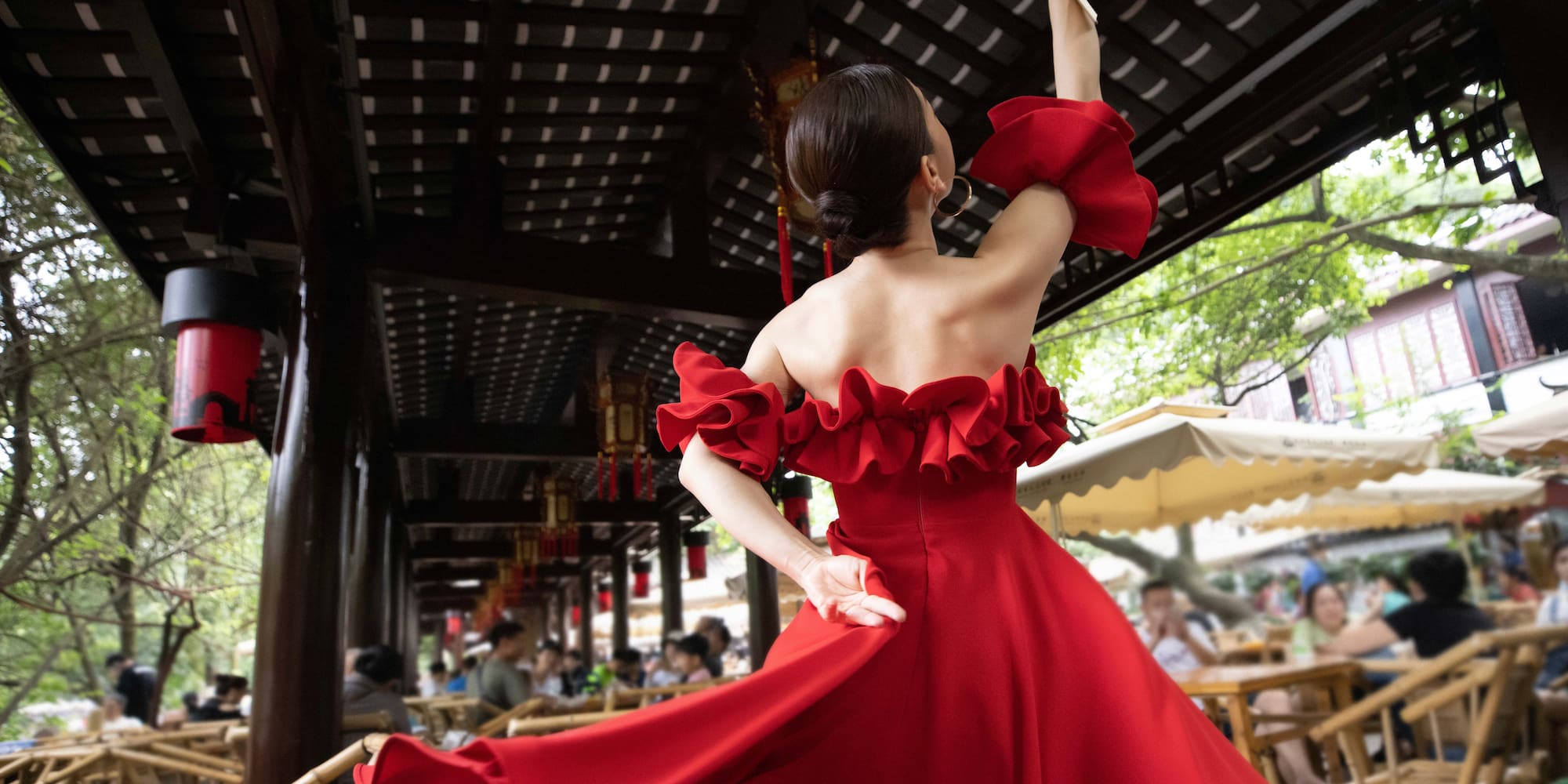 a woman in a red dress dancing