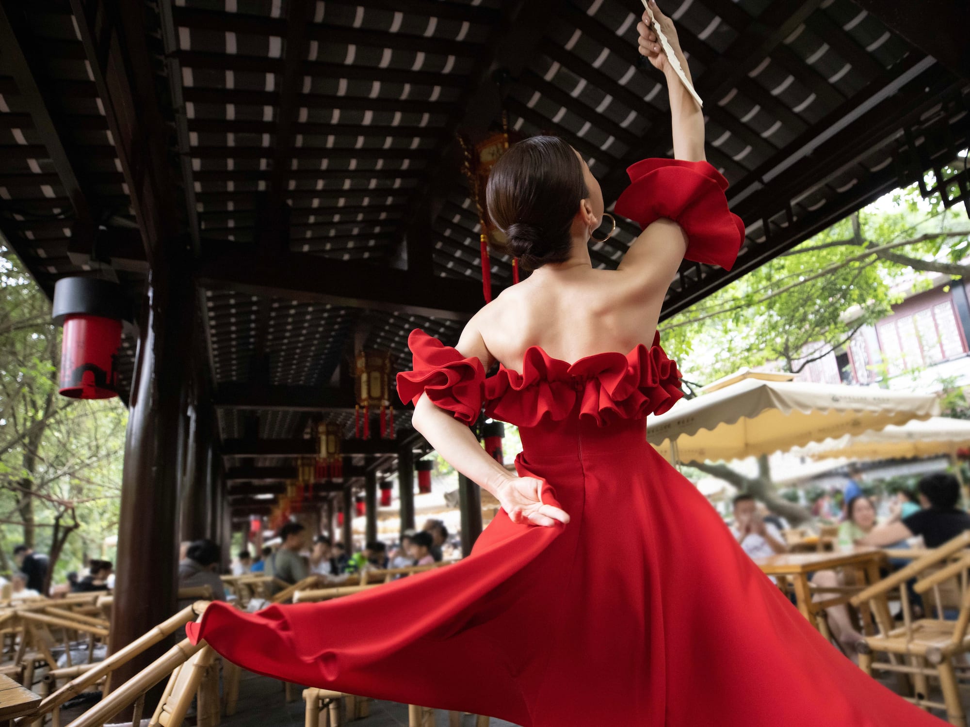 a woman in a red dress dancing