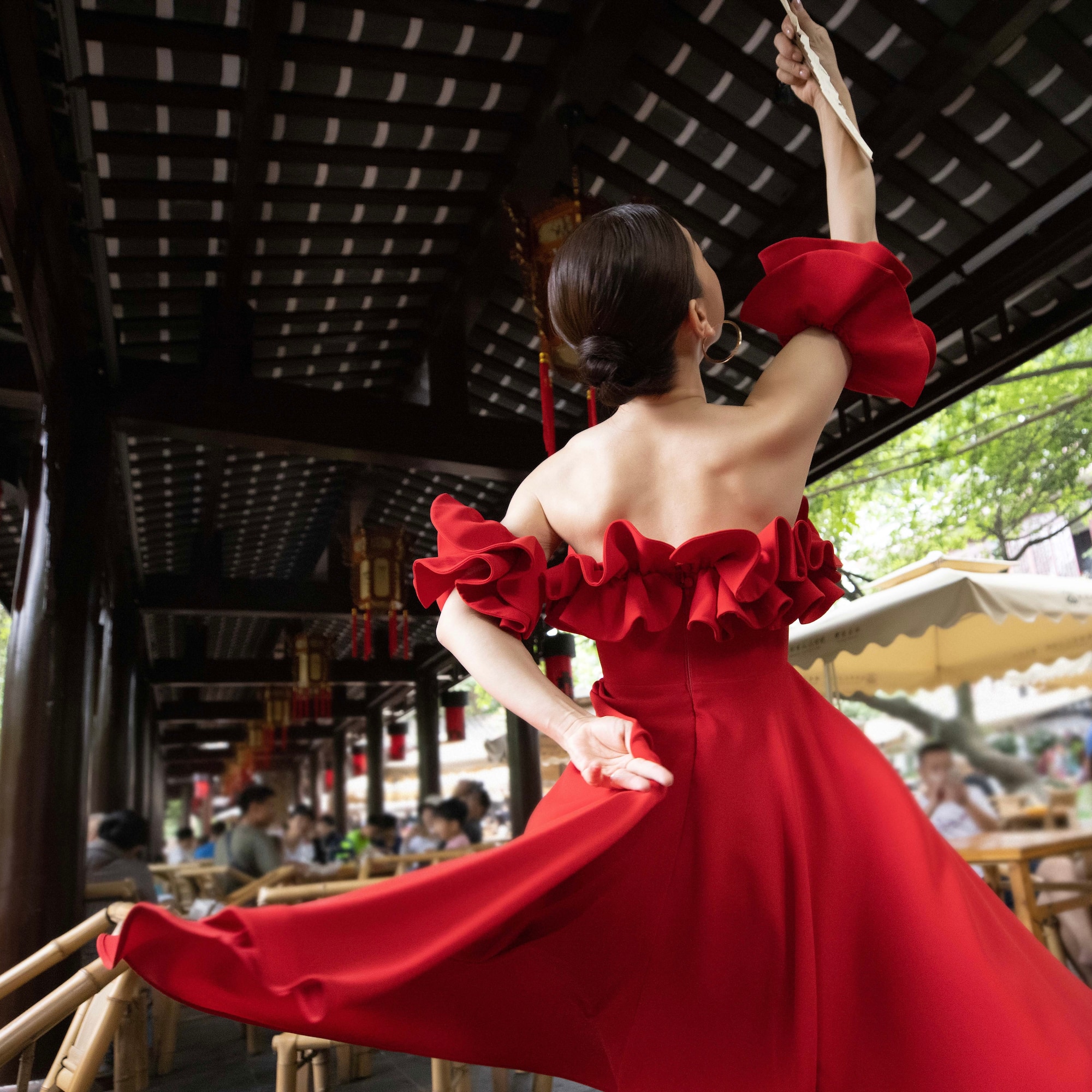 a woman in a red dress dancing